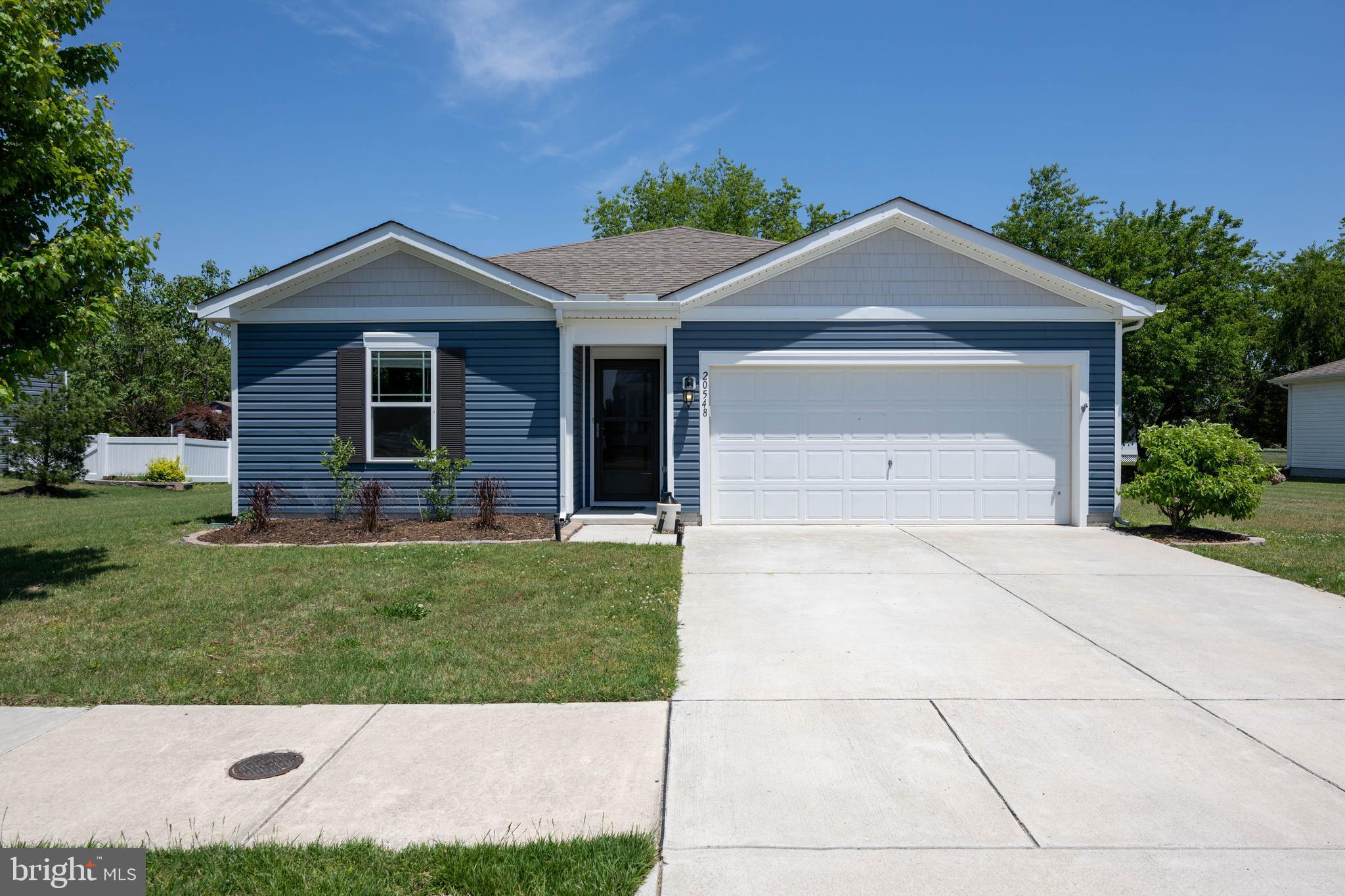 Welcome to this beautifully maintained ranch-style home in the desirable West Shores at New Milford community. Built in 2019, this home offers four spacious bedrooms and two full bathrooms with an open and inviting floor plan designed for comfortable living. The modern kitchen features granite countertops and is equipped with a built-in microwave, gas range/oven, dishwasher, and refrigerator, making everyday meal preparation easy and enjoyable. Additional highlights include a walk-in laundry room, smart home package, and natural gas for cooking. Step outside to the rear deck, perfect for entertaining or relaxing, and enjoy the convenience of an attached two-car garage, ample driveway parking, and a storage shed. Ideally located within walking distance to Bayhealth Milford Campus and just a short drive to area beaches, restaurants, and shopping.