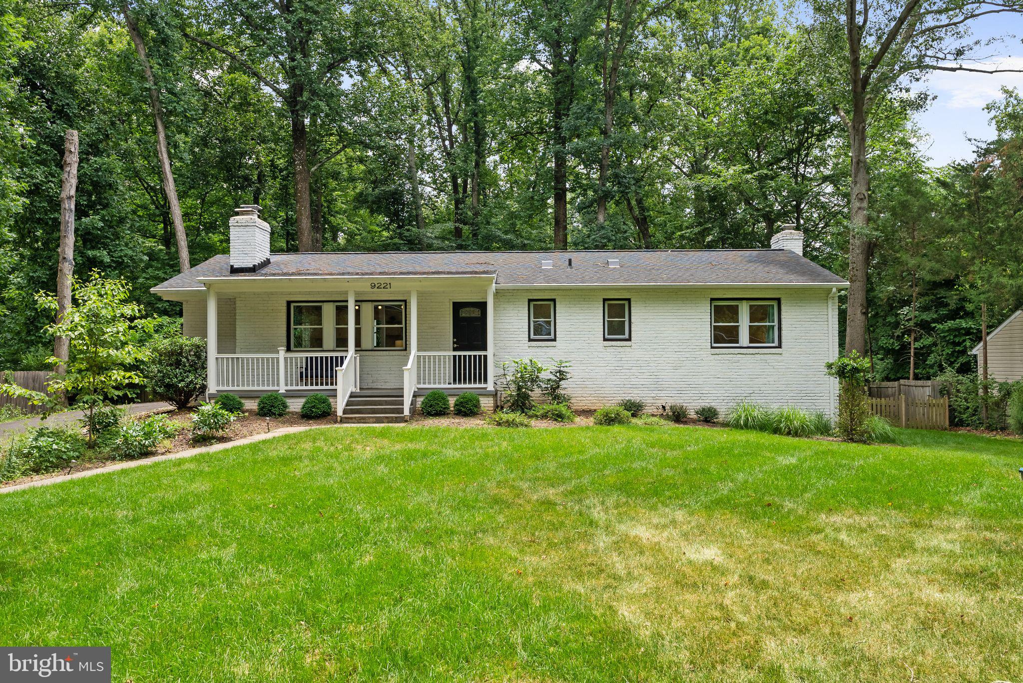Tucked among mature trees on a quiet street with convenient access to Great Falls Park, Riverbend Park, and the Potomac River, this beautifully updated all-brick rambler offers the perfect blend of privacy, convenience, and modern comfort. This home provides a rare opportunity to enjoy nature without sacrificing access to everyday amenities.

Inside, the thoughtfully renovated interior features an open-concept layout designed for both daily living and entertaining. The spacious kitchen serves as the heart of the home, highlighted by a large center island, quartz countertops, stainless steel appliances, and an updated backsplash. Engineered wood floors flow throughout the main level, while abundant windows fill the living spaces with natural light.

Three bedrooms and two full bathrooms are located on the main level, including a spacious primary suite with an en-suite bath. The main level offers the convenience of first-floor laundry and comfortable one-level living. Downstairs, the fully finished walkout lower level feels bright and inviting, with exceptional natural light, a large recreation room, one additional bedroom and full bathroom, and flexible space for guests, hobbies, fitness, or a home office.

Outside, the covered porch and fully fenced backyard create a peaceful retreat surrounded by nature. Recent landscaping enhancements featuring native plantings and a welcoming patio provide the perfect setting for outdoor gatherings or quiet evenings at home.

A major renovation completed in 2020 included a new roof, HVAC system, windows, driveway, and interior finishes. More recent improvements include a new kitchen backsplash, upgraded water treatment system, basement flooring and finishes, electrical heavy-up with EV charger installation, new chimney caps, metal porch roof, and water heater.

Enjoy easy access to the Great Falls Village Centre, home to local favorites including The Old Brogue, Katie's Coffee House, Finn Thai, Authentico, and community events such as the Summer Concert Series, Fourth of July Parade, and Halloween Spooktacular. Conveniently located near Tysons, Reston, and Sterling, this is Great Falls living at its best.

Please note that mold has been identified within this home, reports will be provided to prospective buyers within the disclosure documents. Ask the listing agent for more details.