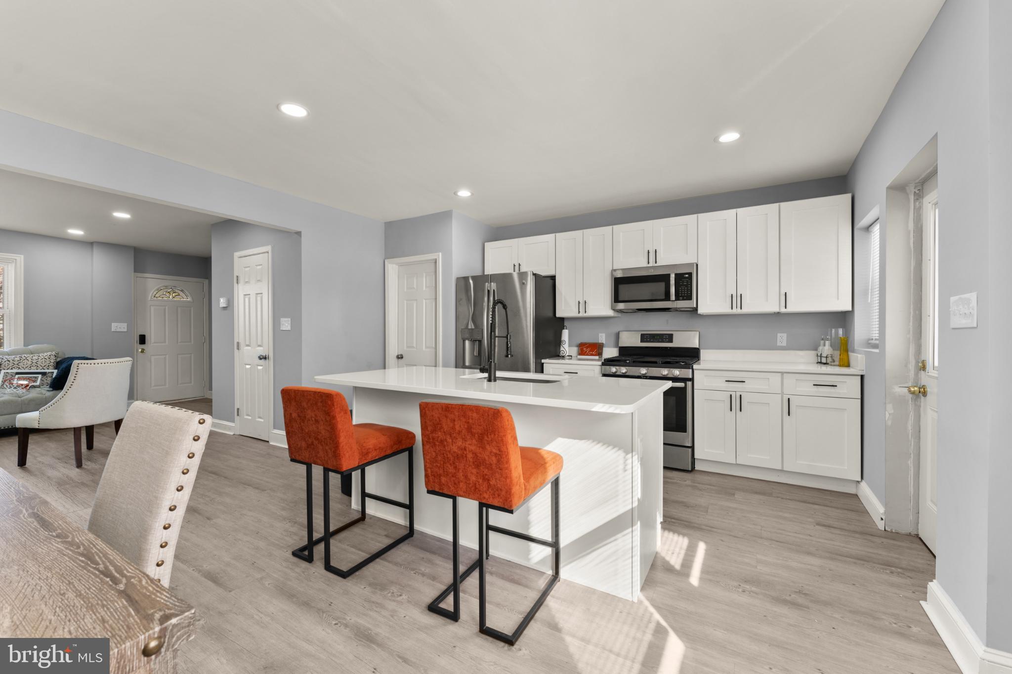 Step inside this move-in-ready gem in the desirable New Northwood neighborhood, where thoughtful updates meet classic charm and modern comfort. Completely renovated just over a year ago, this home feels like new from top to bottom, with all major systems and appliances still practically untouched.

From the moment you arrive, picture yourself welcoming guests on the inviting front porch before entering into a bright and open main level. Luxury vinyl plank flooring flows throughout, creating a clean, cohesive look and effortless living space. The living room transitions naturally into the kitchen, where updated appliances and functional design make meal prep a pleasure. A convenient half bath on the main level adds everyday ease.

Upstairs, discover three comfortable bedrooms and a beautifully updated full bathroom, each room designed for relaxation and privacy. The finished basement extends your living space even further, offering a versatile bonus room, full bath, and recreation area perfect for movie nights, a home gym, or an office.

Every major system has been updated for worry-free ownership: a 1-year-old roof, brand new hot water heater, and nearly new HVAC and appliances mean you can move in with confidence and peace of mind.

Location is everything, just minutes from Morgan State University, the newly reimagined Northwood Commons, grocery stores, and vibrant markets. Enjoy easy access to local farmers' markets, health care centers, shopping, dining, and all the cultural and entertainment offerings of Baltimore. Commuters will appreciate seamless access to major highways, including I-83 and I-695, making trips downtown or throughout the region a breeze.

This home also qualifies for multiple buyer assistance programs, including City and State down-payment and grant opportunities, enhancing affordability for first-time buyers and move-up buyers alike.

Move in, unpack, and start living the lifestyle you’ve been waiting for. This one truly checks all the boxes!