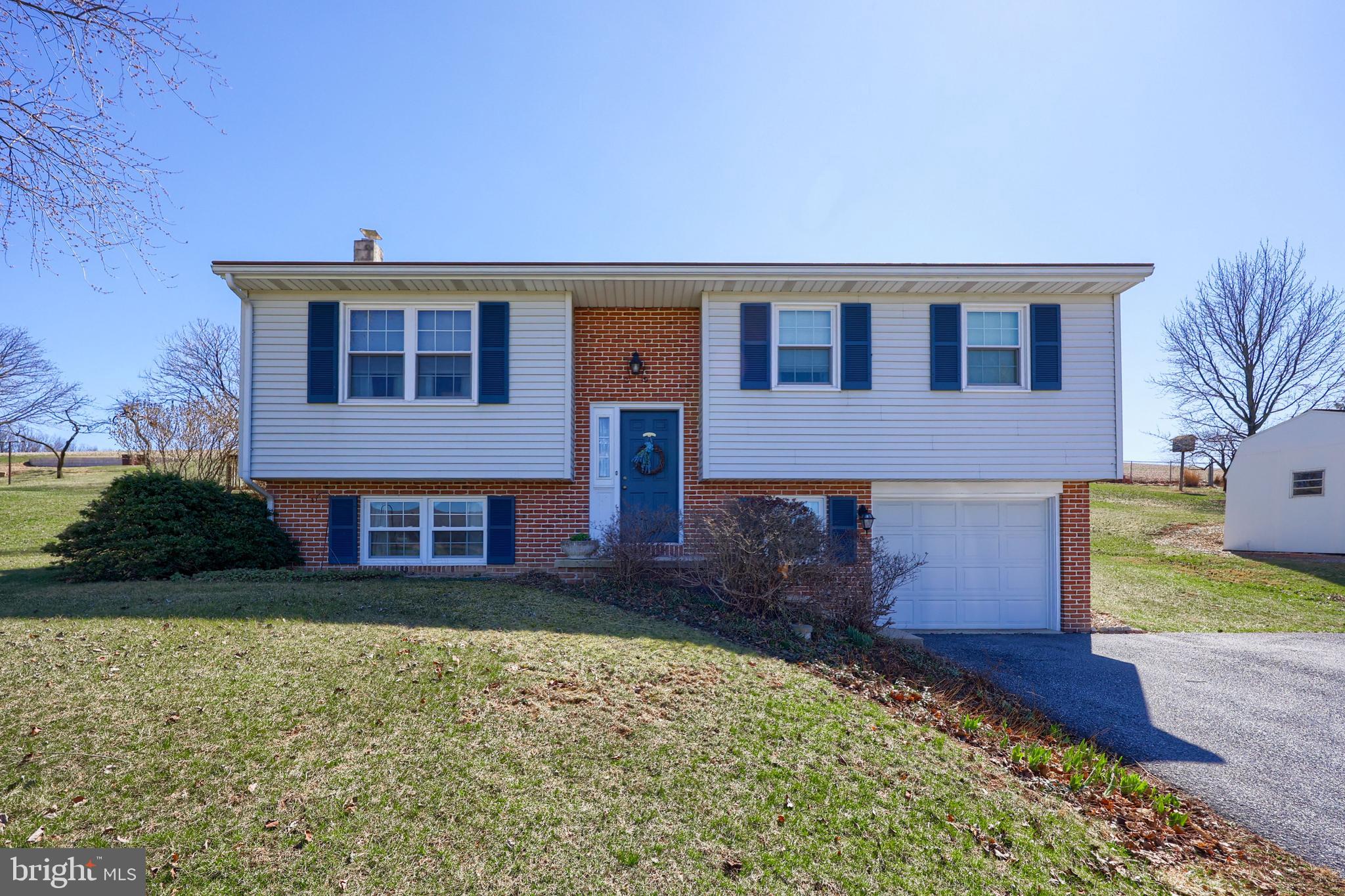 Enjoy breathtaking farmland views from this charming 3-bedroom home in Lititz! Featuring an inviting eat-in kitchen with a breakfast bar, this home is perfect for gatherings. The partially finished basement includes a cozy wood stove and additional storage space. Step outside onto the spacious rear deck—ideal for relaxing or entertaining.