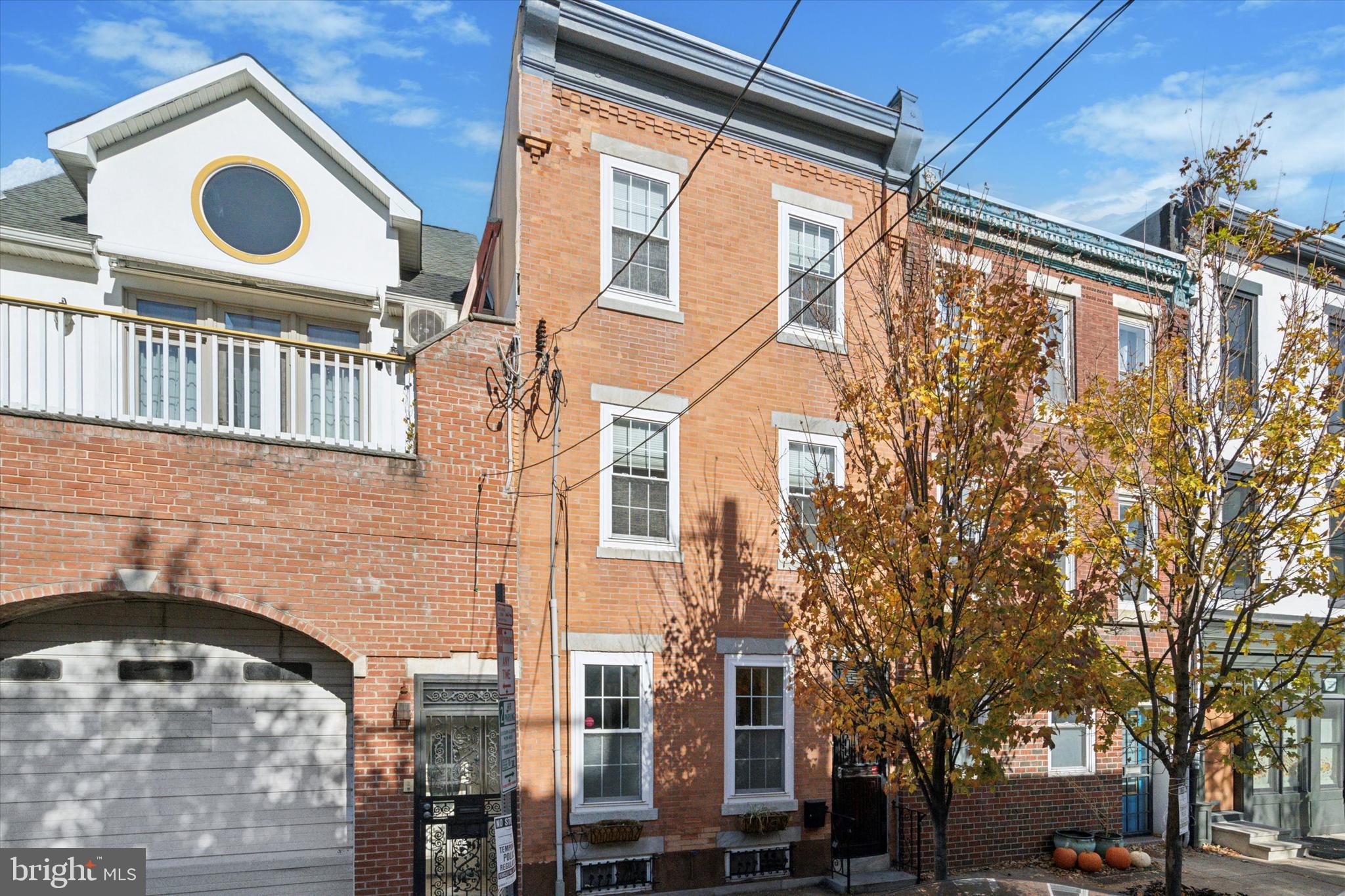 Welcome to 521 Fitzwater St! This stunning 4-bedroom, 3.5-bathroom single-family home effortlessly blends modern amenities with classic charm. Enjoy features like sleek stainless steel appliances, hardwood floors, exposed brick accents, granite countertops, and a built-in wine fridge. The main level greets you with a sun-soaked family room boasting oversized windows and a bright, airy atmosphere. Flow through the dining area and chef-inspired kitchen into the private back patio, perfect for hosting summer dinners or enjoying peaceful evenings outdoors. The finished basement, accessible via a staircase framed by exposed brick, offers a versatile space for a home office, media room, or den, complete with a convenient half bath.

The second level includes two generously sized bedrooms with ample closet space and plenty of natural light, along with a full bathroom featuring a glass-enclosed shower. For added convenience, a laundry room is also located on this floor. The third floor is home to a luxurious primary suite, featuring a large bathroom and an expansive walk-in closet and dressing area. Additionally, a fourth bedroom - previously used as an office - offers oversized windows and a vibrant atmosphere ideal for work or relaxation. The crowning feature of this home is the private rooftop deck, a serene escape with finished wood floors, cushioned benches, and stunning skyline views—an entertainer's dream.

About the Neighborhood: Situated in one of Philadelphia’s most vibrant areas, 521 Fitzwater St offers walkable access to popular attractions like Spruce Street Harbor Park, South Street, Headhouse Square, and Fabrik Row. Nearby parks include Weccacoe Playground, Cianfrani Park, Seger Park & Dog Park, and Palumbo Recreation Center. Commuters will appreciate the proximity to I-95 and public transportation. Local favorites include Jim's South Street, Famous 4th Street Deli, Dottie's Donuts, Sweet Life Bakeshop, Philly AIDS Thrift, and more! This property truly has it all—space, style, and an unbeatable location. Schedule your tour today!