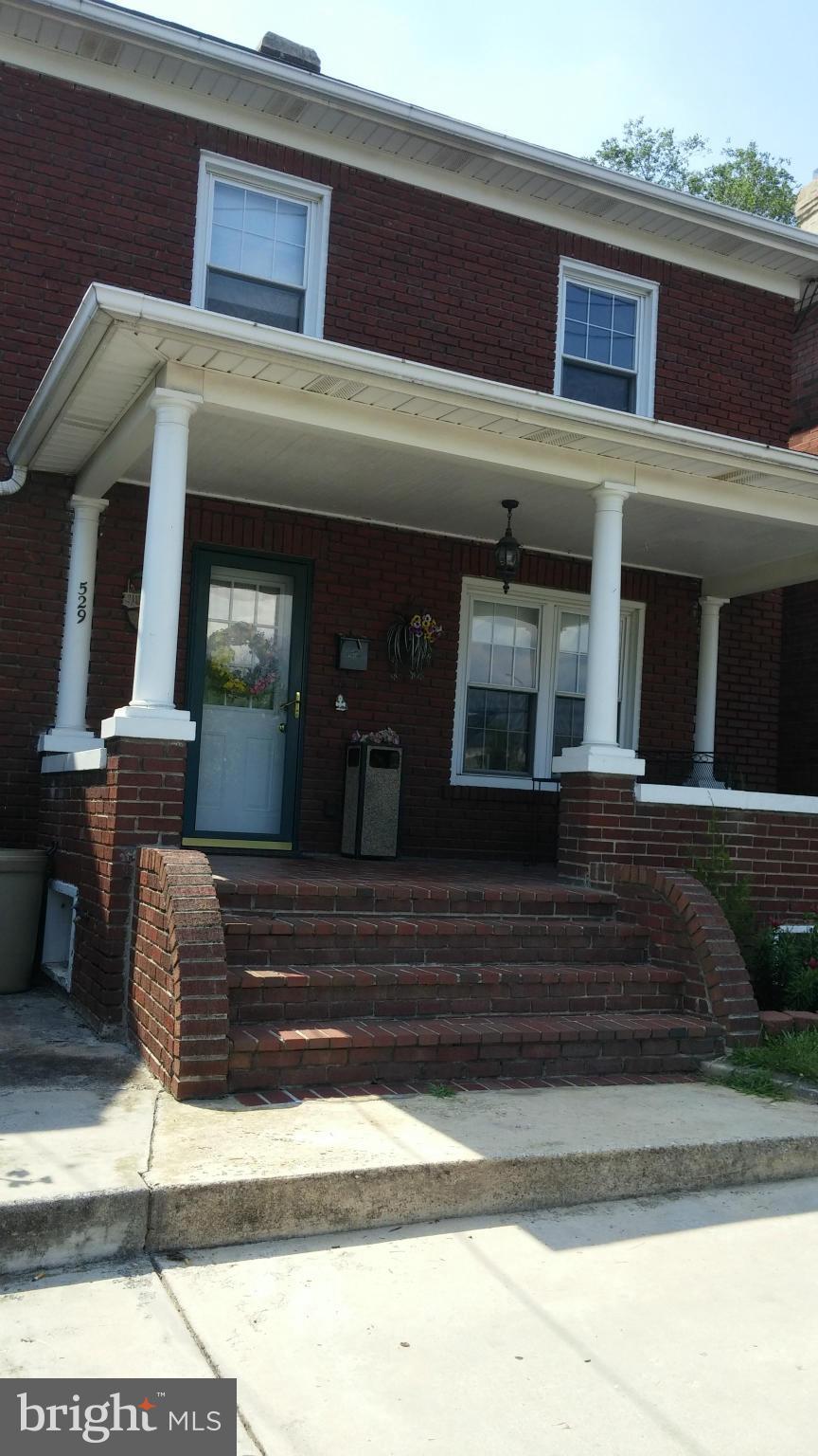 Solid double-brick and frame two story with new roof.  Full floored attic with connecting stairs.   Three bedrooms and full bath on second floor. Washer/dryer & bath in dry basement. Powder room at entry level. Modern kitchen.  Large family room opens to private fenced back yard w/above-ground pool.  Double car garage with access off alley way at rear.  Close downtown..walk to shopping and train.