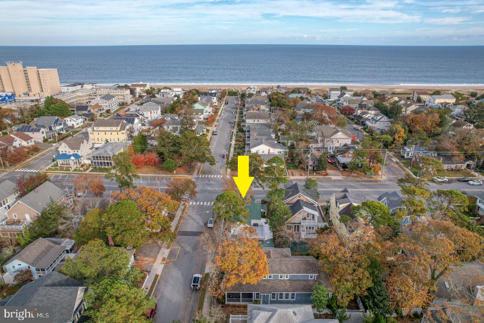 Completely turn-key in South Rehoboth! Located just one block from the beach and boardwalk, this home offers cottage charm and modern-day amenities. The beautifully manicured landscaping, white picket fence, green metal roof, and mature tall pines welcome you home. This home features 6 bedrooms, 4 bathrooms, a game room, and endless outdoor living space, including a fully enclosed wrap-around front porch, an expansive screened-in porch, and a massive second-level sun deck. The enclosed wrap-around front porch has multiple sitting areas and is the prime location to relax and listen to the waves crash, while the screened porch is perfect for enjoying a meal with friends on a beautiful summer night. The second-level deck is ideal for lounging on a sunny day or relaxing under the stars. The deck has been hardwired for a hot tub so you can add even more fun. Inside you will find a spacious family room with a cozy gas fireplace, an L-shaped kitchen with quartz countertops and a dry bar, a dining area, and a massive game room. New hardwood flooring and plenty of windows create a bright, warm, and inviting atmosphere. The primary suite is true luxury with an incredible spa-like bathroom, a walk-in closet with a built-in organization system, and private access to the sun deck. The recently renovated bathroom is outfitted with two vanities, a freestanding soaking tub, and an impressive walk-in shower, tiled from floor to ceiling. Feel free to invite friends and family to stay! No matter how many visitors you have, there is space for them all with five guest bedrooms, three on the first level and two more upstairs. Three bathrooms, all featuring tiled floors and showers, are conveniently located close by. Other features of this incredible home include recessed lighting, a large shed for storing all of your beach gear and bicycles, two off-street parking spots (one covered), an outdoor shower, an irrigation system, a wired surround sound system throughout the home, and much more. With the current city code, you would not be able to build a home of this size making this a truly unique property. This home would make an incredible primary home, vacation home, or investment property with over $120,000 in annual revenue. It’s being sold fully furnished so you can enjoy it from day one. Call today for a private tour!