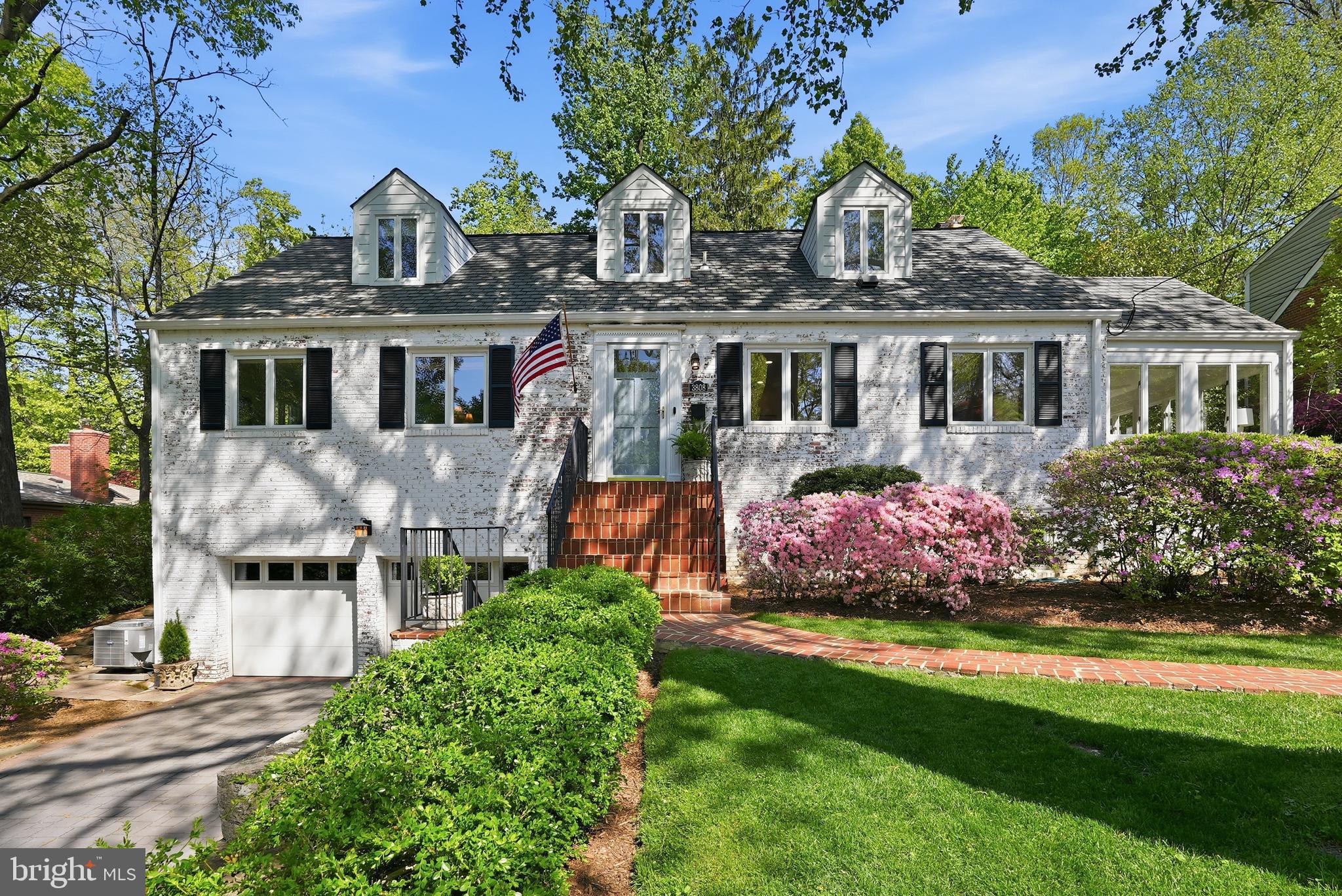 Prominently sited on a beautifully landscaped lot in Arlington’s sought-after Bellevue Forest, this five-bedroom, four-bath classic has been thoughtfully updated and meticulously maintained. A charming whitewashed brick exterior introduces the home, set back from the street and framed by a lush front lawn and a curved red brick walkway. Inside, gleaming hardwood floors and elegant interiors create a warm, inviting atmosphere.

The sunlit living room features a fireplace, crown molding, and a large picture window overlooking the rear gardens. A wide opening leads to the formal dining room with a new chandelier, while French doors open to a bright, year-round sunroom with windows on three sides and access to the patio. The eat-in kitchen offers white cabinetry, granite countertops, stainless steel appliances, and updated hardware.

Three bedrooms are located on the main level, including a spacious primary suite with two closets and an updated bath. Upstairs, two additional bedrooms with vaulted ceilings and dormers share a large bath with a spa tub and separate shower. The lower level provides flexible living space with a family room, fitness area, laundry with new washer and dryer, full bath, garage access, and ample storage.

Extensive improvements reflect true pride of ownership, including fresh interior paint, all new lighting, enhanced insulation and air sealing, updated electrical systems, a new HVAC system with smart thermostats, chimney repointing and relining, and waterproofing enhancements.

The backyard has been thoughtfully reimagined with a flagstone patio and steps, retaining walls with integrated drainage, new fencing, and professionally landscaped grounds. A terraced upper yard with pathways, a fire pit, and multiple seating areas creates a private setting for relaxing and entertaining.

Ideally located in Bellevue Forest, this quiet, wooded neighborhood offers easy access to Washington, DC and nearby parks including Potomac Overlook Regional Park, Gulf Branch Nature Center, and Zachary Taylor Park, along with Marcey Road Park and the Donaldson Run Recreation Association pool (membership available, waitlist may apply). Video forthcoming.
