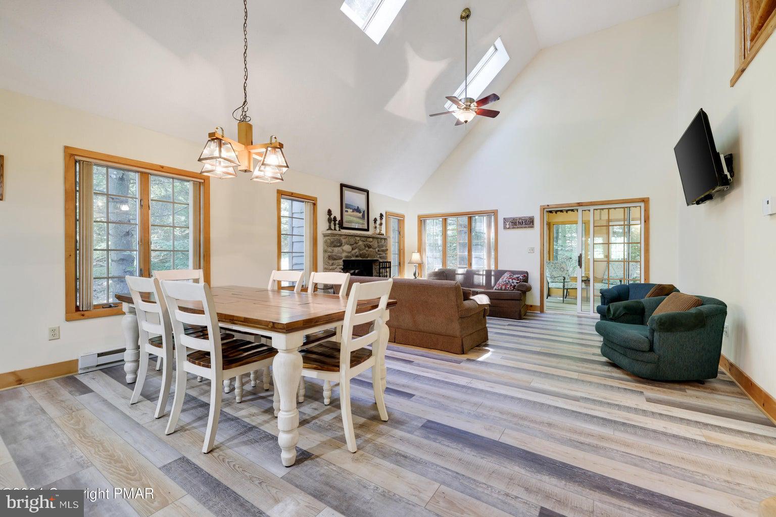 Discover the ultimate four-season retreat in Snow Ridge Village at Jack Frost Mountain. This mountain chalet, is ideally located within close proximity to the ski slopes. This spacious home features 4 bedrooms, with 3 full bathrooms. The warm and inviting interior showcases vaulted ceilings, and an open-concept living area designed for gathering after a day outdoors. The well-equipped kitchen flows effortlessly into the dining and living spaces. A dedicated hot tub room offers the perfect place to relax and unwind year-round. There is an opportunity to join the private Mountain Lake Club, offering beach access and a wide range of outdoor activities including swimming, kayaking, paddleboarding, hiking, and seasonal recreation. Whether you're seeking a vacation getaway, or investment property, this chalet delivers the perfect blend of adventure, relaxation, and mountain lifestyle living.