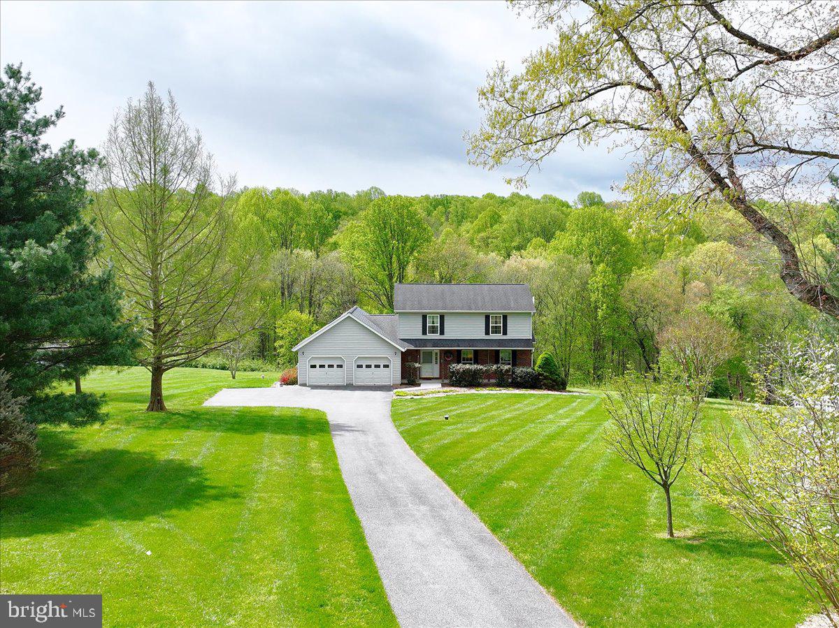 FIRST OPEN HOUSE WEEKEND!! ----   SUNDAY APRIL 26TH 1-3PM
Welcome to Cabin Branch Farm in Woodbine—where privacy, space, and everyday comfort come together.
Tucked at the end of a long private drive, this updated colonial sits on 3 peaceful acres backing to the natural beauty of Patuxent River State Park—perfect for quiet mornings and relaxed evenings on the covered deck.
Inside, the heart of the home is a bright, gourmet kitchen featuring granite countertops, stainless steel appliances,Double Oven Convection,  a coffee/bar station, and Oversized Parking Pad, and a sunny eat-in area with serene views of the Patuxent river State Park!   It opens seamlessly to a vaulted family room—ideal for gathering and entertaining.
Upstairs, the spacious primary suite offers a beautifully renovated bath and spacious walk-in closet, with two additional large bedrooms and updated hall bath. The large walk-out lower level is ready for your vision.
A setting that feels like a retreat—yet designed for the way families live today.
Homes with this much land, this kind of kitchen, and this level of peace don’t stay available—schedule your private showing today before someone else claims your escape. Howard Public schools as -- Lisbon Elementary, Glenwood Middle, and Glenlg High School. 
MAJOR UPDATES ALREADY DONE FOR THE NEW BUYERS!!  Furnance and HVAC (2010), Hot Water Heater (2015),
 Roof (2015), Kitchen (2016), All Bathrooms (2019), Anderson Sliding Glass Door in family room our to deck (2020), Septic Tank evaluated and pumped (2022),  New Carpeting (2022),  new well pressure tank & upgraded water filter (2023), well water manifold in basement (2025), AND MORE!!