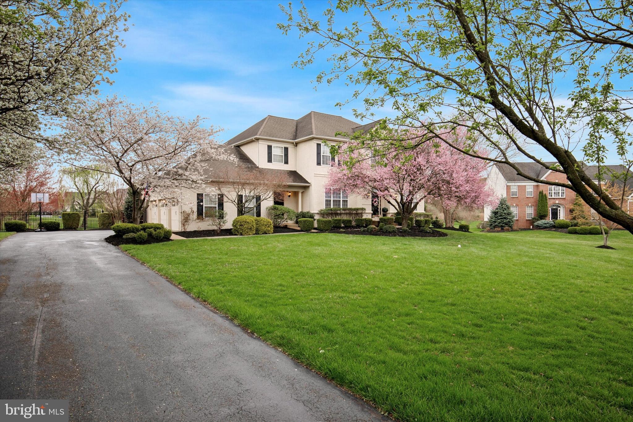Welcome to refined suburban living at its finest in the prestigious Wainwright at Whitemarsh community. This stunning Colonial home blends timeless elegance with modern comfort, nestled on a beautifully landscaped lot adorned with mature trees and vibrant seasonal blooms. As you arrive, the curb appeal is undeniable—setting the tone for the exceptional living experience inside. Step through the grand, two-story foyer where gleaming hardwood floors and an abundance of natural light immediately impress. The expansive floor plan flows effortlessly, beginning with a sunlit formal living room and a sophisticated dining room accented with classic wainscoting—perfect for elegant dinners and festive gatherings. A versatile bonus room offers the ideal space for a home office or cozy sitting area. At the heart of the home lies a spacious, gourmet kitchen featuring crisp white cabinetry, a central island with seating, recessed lighting, and generous dining space. A charming additional seating nook by the sliding glass doors offers the perfect spot to enjoy morning coffee or unwind with a book. The adjacent great room is both inviting and dramatic, showcasing a coffered ceiling, plush wall-to-wall carpeting, a cozy gas fireplace, and sun-drenched windows that fill the space with warmth and light. Completing the main level is a well-appointed powder room and a laundry room, adding convenience to everyday living. Upstairs, the luxurious primary bedroom is a private retreat with a generous layout that includes a sitting area, an oversized walk-in closet, and a spa-like ensuite bathroom with dual vanities, a soaking tub, a glass-enclosed shower, and a semi-private water closet. Two additional bedrooms have their own walk-in closets and share a well-designed Jack and Jill bathroom, while a fourth bedroom with its own full bathroom is perfect for guests or in-laws. The fully finished lower level is an entertainer’s dream, complete with a wet bar, plenty of seating, expansive recreational space, an additional powder room for guests and ample storage space. Step outside to your own private oasis—an expansive deck with a pergola overlooks the serene backyard, offering the ideal setting for outdoor dining and relaxation. Additional highlights include an oversized three-car garage and a spacious driveway, providing ample parking for family and guests. Located within the award-winning Colonial School District and zoned for Ridge Park Elementary, this home also offers easy access to major roadways, shopping, dining, and more. 205 Kensey Road is more than just a home; it’s a lifestyle. Don’t miss your chance to make it yours!