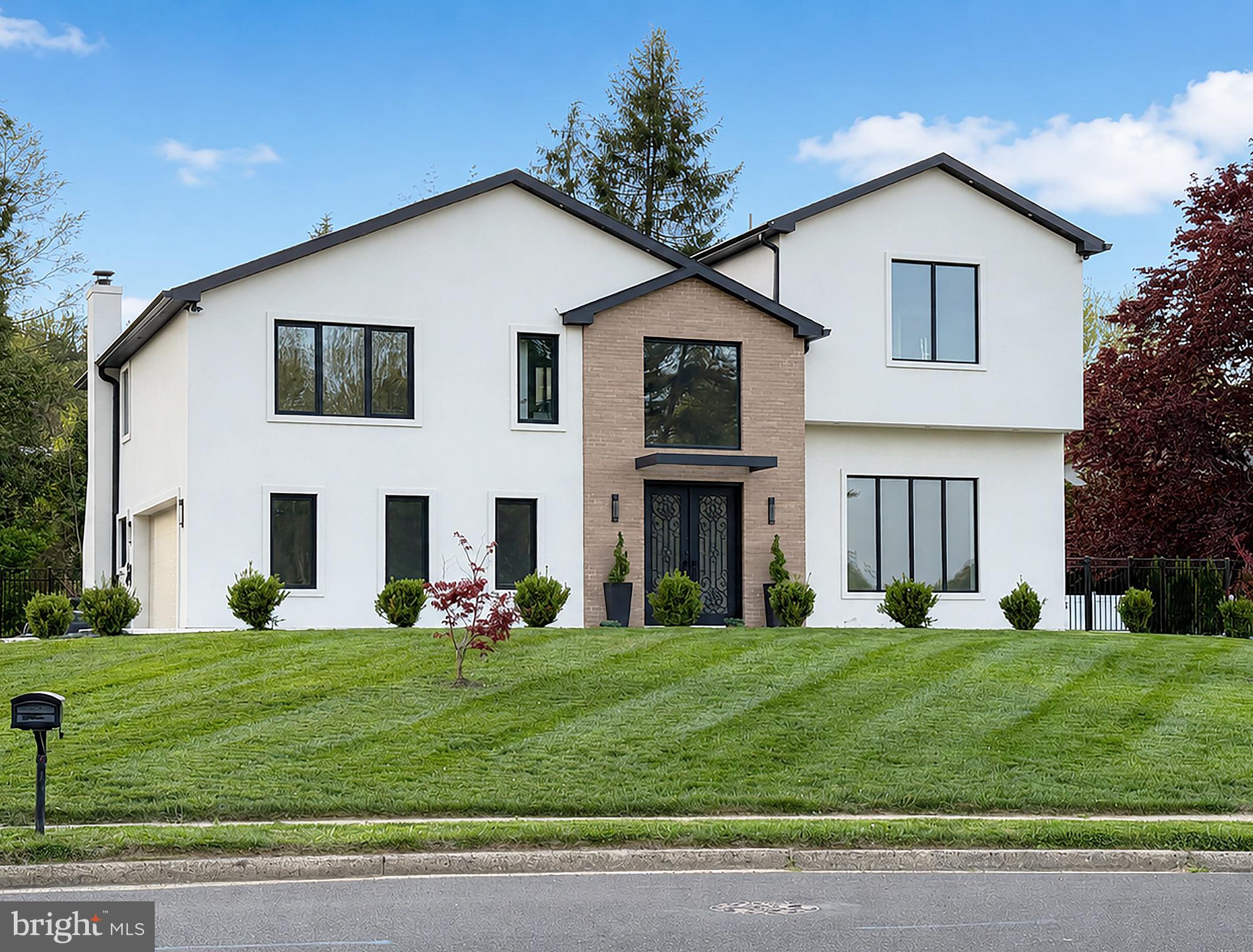 Not all renovations are created equal. This one was reimagined from the ground up.

Tucked away in one of Huntingdon Valley's most sought-after neighborhoods and just steps from Lower Moreland Township Park, this extraordinary custom residence offers something rarely found in today's market—the quality, scale, and craftsmanship of a newly built luxury home, without the burden of new construction taxes.

Behind its striking modern exterior lies a home that has undergone a remarkable transformation, with over $585,000  invested in rebuilding nearly every major component. From new framing, roof, windows, plumbing, electrical, HVAC, insulation, and mechanical systems to meticulously selected designer finishes, this is far more than a renovation—it's a complete reinvention.

The moment you enter, soaring ceilings, a dramatic open staircase, and walls of natural light create an unforgettable first impression. Wide-plank engineered hardwood flooring flows throughout the home, while expansive living spaces were designed to feel both sophisticated and welcoming.

At the heart of the home, the stunning chef's kitchen blends timeless design with everyday functionality, featuring an oversized quartz island, premium cabinetry, stainless steel appliances, double wall ovens, and seamless access to the backyard—making entertaining effortless.

The home's thoughtful layout offers exceptional flexibility. Two private suites each feature their own en-suite bathroom, while the primary suite occupies its own level, creating a true owner's retreat complete with two walk-in closets, a Juliet balcony, and a spa-inspired bath designed for relaxation.

Step outside and imagine the possibilities.

Set on nearly half an acre, the backyard provides the rare opportunity to create the ultimate outdoor retreat—with ample space for a custom swimming pool, jacuzzi, outdoor kitchen, covered patio, fire pit, and expansive lawn, all without feeling crowded. A dedicated gas line has already been installed for a future pool heater, making your vision even easier to bring to life.

Practical luxury continues throughout the home with two high-efficiency Carrier Infinity HVAC systems, spray foam insulation, a two-car garage with an electric vehicle charger, premium windows, and countless behind-the-scenes upgrades that deliver comfort, efficiency, and long-term peace of mind.

Location is just as impressive as the home itself. Walk to Lower Moreland Township Park for playgrounds, walking trails, tennis courts, athletic fields, and year-round community activities, while enjoying the convenience of award-winning Lower Moreland Schools, nearby shopping, dining, and easy access to Philadelphia. Some homes are updated. Some homes are renovated. This home was rebuilt with intention, designed for the future, and crafted to be enjoyed for generations. Come experience the difference for yourself.