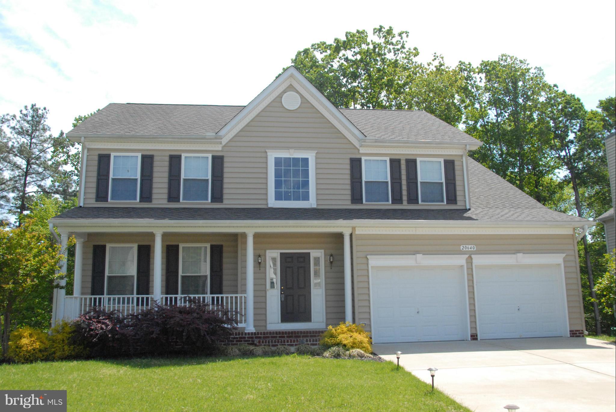 Beautiful Preston model on premium lot backing to trees at end of the cul-de-sac! Approximately 4000sq ft!  Finished basement with full bath, home theater system, and a wood shop!  Screened in porch to enjoy the privacy. Beautiful kitchen with hardwood floors, maple cabinets, corian counter tops, double ovens and more.  Security system throughout, sprinkler system, gas fireplace! It has it all!