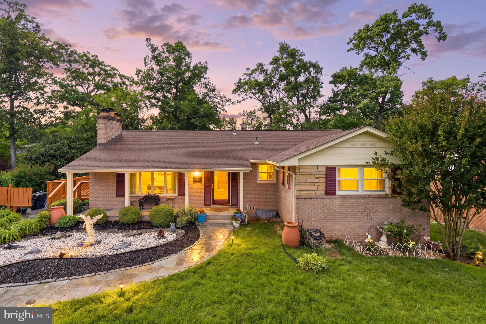 Beautiful brick rambler in the sought after College Park Woods. This home is unique and one of the largest in the area. Come through the main foyer to a large living room with a fireplace, formal dining room, and updated kitchen with custom cabinets, granite counter tops, and stainless-steel appliances. Main level has 3 bedrooms, full bath, and primary bedroom with primary bath. Recessed lighting and hardwood floors throughout. Customized closets for plenty of storage.
In need of fresh air, go through the kitchen to the large deck and relax in the garden oasis in the large, fenced backyard.
Lower level has 3 bedrooms, 1 bath, 2nd kitchen, laundry with cabinets and counter space for folding and storage, and recreation room with wood burning fireplace perfect for entertaining or just cozy up on a snowy day. Rec room goes to a large backyard with trees for privacy and a sidewalk that goes around the house. Can be used as an in-law suite or potential rental income. Enjoy the landscaping design over tea on the front porch.
Close to shopping, dining, major commuter routes (I-495, 295, & 50), and University of Maryland. Minutes from Greenbelt and College Park Metro and future access to the Purple Line.  UMD Shuttle & public bus service are easily accessible. Plenty of outdoor options close by include Paint Branch Trail, College Park Woods Park, and College Park Woods Clubhouse. The list is endless!
