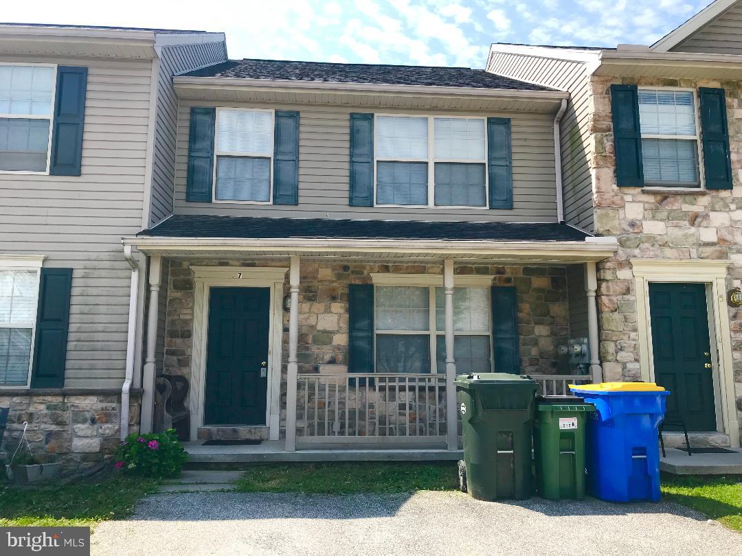 AFFORDABLE TOWN HOME in South Western School District. Near MD/PA line and shopping conveniences! Move in ready with neutral colors, new carpeting upstairs, new kitchen floor, and full, dry, daylight basement ready to finish! Large eat-in kitchen! Half bath and laundry on main floor! Covered front porch to sit out and watch the rain or snow fall! Back yard backs up to trees and seasonal creek. Possibility to add small deck or balcony to enjoy the view. Very little yard work! Why rent when you can own your very own home for similar payment? First time home buyers, take a look! Make your appointment to see inside today