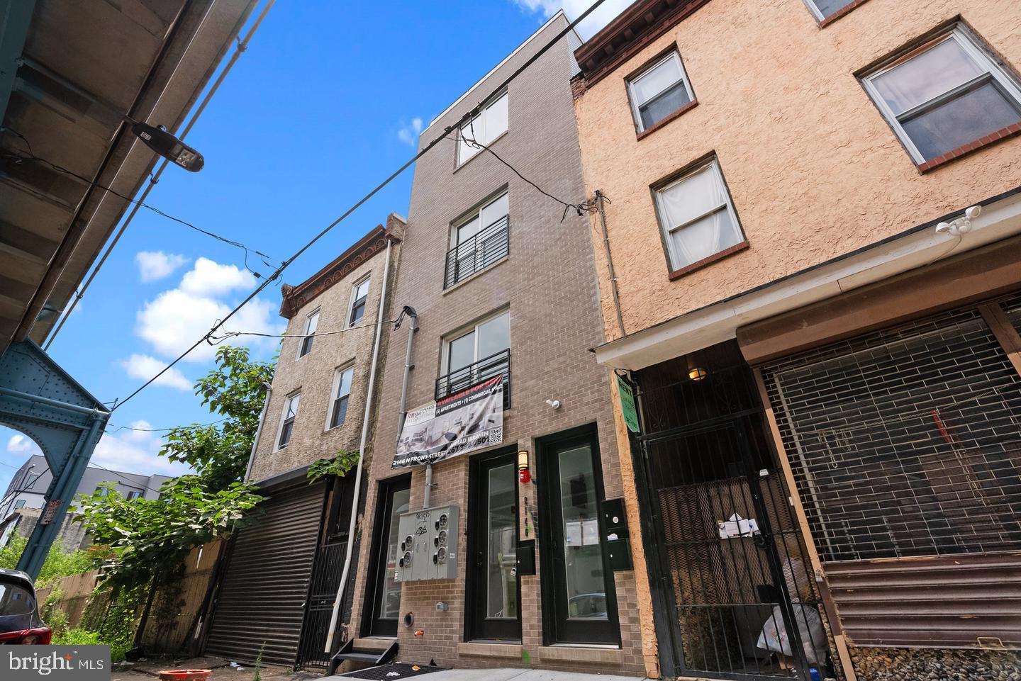 Experience modern living and smart investing with this newly built property, offering three well-designed residential units plus a commercial storefront in the vibrant heart of Norris Square.

This opportunity is perfect for a buy-and-hold investor or a homeowner-occupant (eligible for just 5% down). When fully leased, the property generates $6,150 per month in actual rental income. Currently, Unit 3 has been intentionally left vacant to accommodate buyers who may want to live on site while collecting rent from the other units.

With 9 years remaining on the tax abatement, the fast growing and appreciating location and minimal upkeep required, this is a low-maintenance, high-return investment that checks all the boxes. 

Unit 1: A striking bi-level apartment offering two generously sized bedrooms and two full baths, each appointed with stylish tile finishes. Soaring 9-foot ceilings create a spacious atmosphere throughout. The chef’s kitchen is outfitted with 36-inch sleek, flat-panel cabinetry, quartz counters, a modern herringbone backsplash, and premium stainless-steel appliances. A washer and dryer are included for added convenience. The highlight is private access to a large backyard oasis, perfect for relaxation or entertaining.

Unit 2: A contemporary 1-bedroom, 1-bathroom flat designed with laminate flooring, 9-foot ceilings, and a dedicated laundry area. The kitchen features streamlined flat-panel cabinetry, a striking herringbone backsplash, stainless-steel appliances,

Unit 3: Occupying the top two levels, this penthouse-style residence includes three spacious bedrooms, each paired with its own full bath. The main-floor primary suite boasts ample room for oversized furniture, a walk-in closet, and a spa-like en-suite with a glass-enclosed shower, tiled floors and walls, and modern vanities. The open living area features a bright kitchen with quartz counters, flat-panel cabinetry, stainless appliances, and a signature herringbone backsplash. Oversized windows bring in panoramic city views,  The crowning feature: a private roof deck with 360-degree vistas of Center City — an ideal setting for outdoor entertaining.

Commercial Space: Well sized, Positioned at street level and collecting rent.

This newer construction is located in one of Philadelphia's fastest growing and appreciating neighborhoods ,walkable to some of the city's best restaurants, bars and cafes.