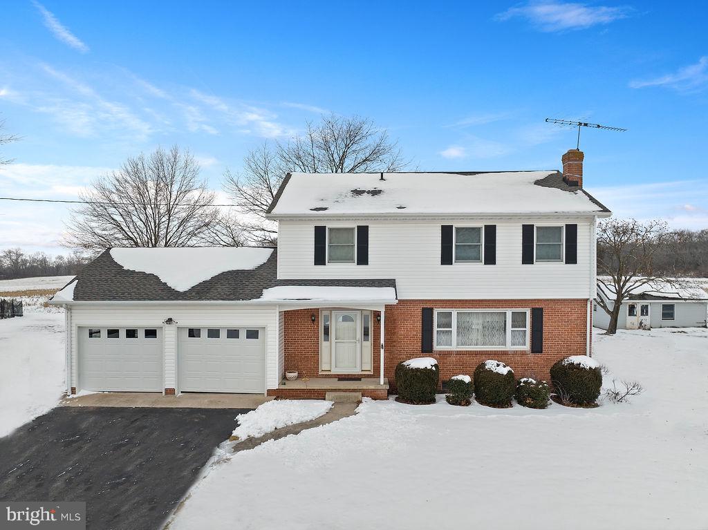 Located just minutes from downtown Gettysburg, this 2 story has lots to offer.  This very well maintained  house features 3 bedrooms one full and on half bath, first floor hardwood foyer, second floor is all hardwood with the full bathroom having ceramic flooring,  full glass sunroom with ceramic tile flooring,  upgraded kitchen with high end cabinetry and granite tops, cozy den, composite deck and full unfinished basement.  Surrounded  by 39 acres of open land make this a perfect place to relax and entertain.  Located in the Gettysburg School District.  Included is a 15x25 detached shed with electric service.