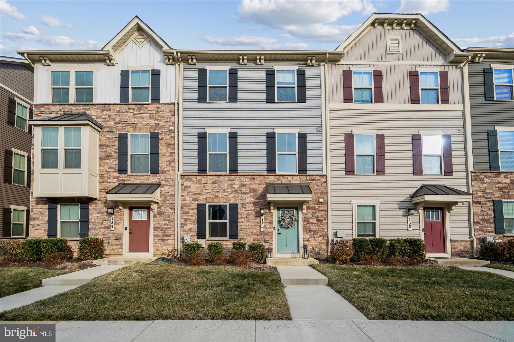 **NEW Price at $515,000 ** Beautiful like new, two car garage townhouse in sought after Patuxent Green neighborhood. Come into the first level with a fully finished basement, garage and powder room. Walking up the stairs to the main level take in all the open space. From your spacious family room that flows seamlessly  into your kitchen it's an entertainers dream. The deck has been extended to be one of the largest in the entire neighborhood. Your top level you have 3 bedrooms, laundry room and hall bath. Your spacious primary suite has a large closet, tray ceilings and large shower with two showerheads. This is a home you don't want to miss!