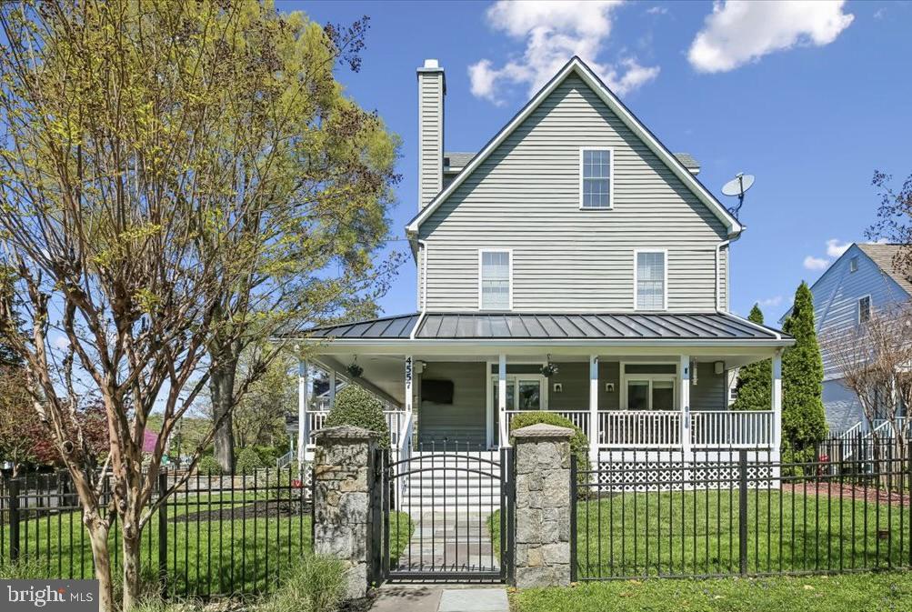 Great New Price! Welcome to 4557 Fairfield Drive, blending timeless charm and thoughtful updates with exceptional curb appeal. The classic façade is complemented by a wraparound front porch, creating a warm and inviting presence while providing the perfect setting for outdoor lounging, dining, or simply enjoying the neighborhood streetscape. Elevated above the street and approached by a stone walkway, the property is framed by a manicured lawn, mature trees, and seasonal plantings. From every angle, the property reflects a seamless blend of classic design, modern livability, and inviting outdoor spaces. At the heart of the home, a stunning Poggenpohl kitchen sets a tone of understated luxury and precision design. Clean-lined European cabinetry in warm wood tones is paired with sleek matte finishes, creating a refined yet welcoming aesthetic. Expansive waterfall-edge quartz islands provide striking visual impact while offering generous space for cooking, gathering, and entertaining. Outfitted with integrated, top-tier Miele appliances—including a built-in coffee system, wall ovens, and a professional-grade gas cooktop—the kitchen is thoughtfully designed for both form and function. Custom storage solutions are seamlessly incorporated throughout, maintaining the minimalist elegance Poggenpohl is known for. The space flows effortlessly into adjacent living and dining areas, making it equally suited for everyday living and sophisticated entertaining. Upstairs, the bedroom level offers a well-balanced and functional layout. The primary suite features two closets—including a walk-in—and a private en suite bath, creating a comfortable retreat. This level also includes a second bedroom and full hall bath, as well as a smaller third bedroom ideal for a home office, nursery, or flex space. Laundry is conveniently located on this floor. The top floor expands the home’s versatility with two additional bedrooms and a full bath. The fully finished lower level is anchored by a sleek Poggenpohl-designed secondary kitchen and bar area. A large central island with seating serves as a natural gathering point, complemented by integrated appliances and a wine refrigerator—ideal for entertaining. Custom built-ins provide concealed storage while maintaining clean, modern lines, and the open layout transitions seamlessly into a media lounge, enhanced by a textured feature wall, warm wood cabinetry, and durable tile flooring. Originally built in 2005, this home has been extensively updated and meticulously maintained, reflecting true pride of ownership. Major improvements include a redesigned paver driveway, along with an attractive fence anchored by stone pillars. Interior renovations have thoughtfully modernized the home, including updates to both powder rooms, a renovated third-floor bathroom, and a significant main-level remodel featuring new flooring and updated porch windows and doors. Mechanical systems have also been carefully maintained, with HVAC systems replaced (2018), water heaters updated (2020), and a new sump pump installed (2026). This A+ location provides easy access to Metro (NIH or Bethesda), along with the vibrant dining, shopping, and cultural amenities of downtown Bethesda. Just minutes from NIH, Walter Reed National Military Medical Center, and Rock Creek Park, this highly walkable location perfectly balances neighborhood tranquility with urban convenience.