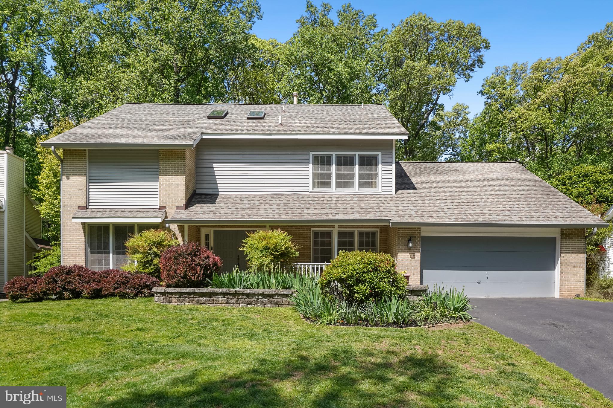 Welcome to 14520 Pebble Hill Lane! Nestled in the desirable Flints Grove community of North Potomac. This stunning single-family home offers over 3,500 square feet with 4 bedrooms, 2.5 bathrooms, and an attached garage. Located on a beautifully landscaped .27-acre lot with a private heated in-ground pool and hot tub. Situated on a peaceful street, this home combines timeless charm with spacious indoor and outdoor living.

A welcoming front porch leads into the foyer with gleaming wood flooring and flanked by formal living and dining rooms. The light-filled living room showcases large windows, while the spacious dining room offers elegant molding details and ample table space for entertaining. The upgraded eat-in kitchen is complete with granite countertops, stainless steel appliances including a double wall oven, center island, and abundant cabinetry. Just off the breakfast area, step out onto the expansive rear deck overlooking the lush backyard oasis with pool and hot tub below.

Adjacent to the kitchen is an enclosed porch with vaulted ceilings and serene backyard views. The dramatic family room features a soaring two-story vaulted ceiling and a stunning floor-to-ceiling stone wood-burning fireplace.

Upstairs, the spacious primary suite includes a sitting area overlooking the family room, dual closets, and a luxurious ensuite bath with jetted soaking tub, dual sink vanity, and walk-in shower. Three additional well-appointed bedrooms share a hallway full bath, and the convenience of bedroom-level laundry completes the upper level.

The unfinished lower level offers endless potential for future living space, recreation, or storage. Ideally located just minutes from shops, restaurants, parks, and commuter routes, this exceptional home also feeds into highly sought-after Wootton High School. Residents of Flints Grove enjoy expansive walking trails and community basketball courts. Schedule your showing today!