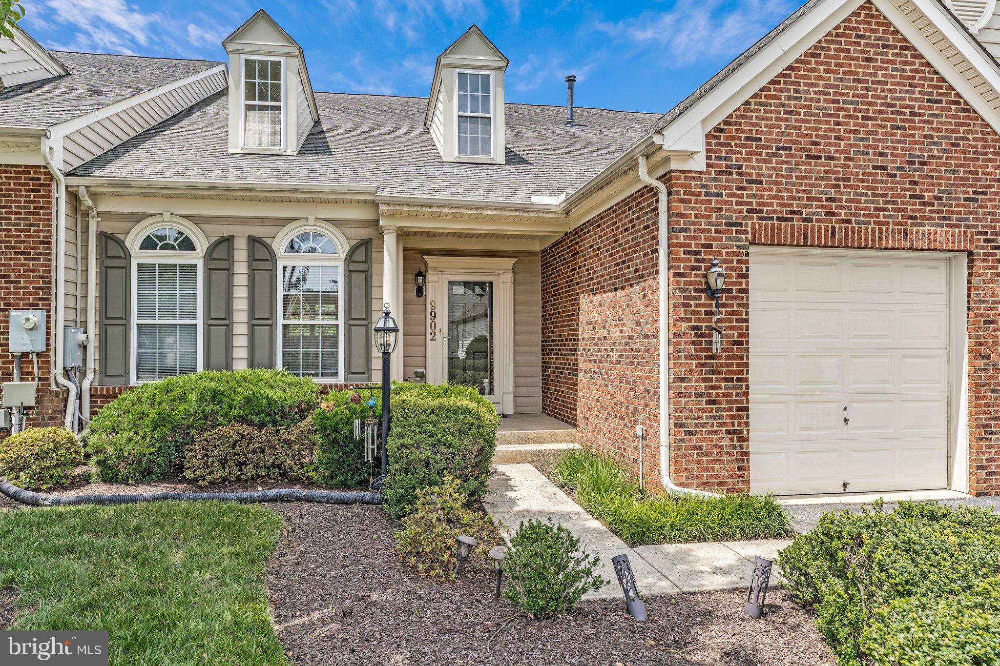 Welcome to 9902 Hillandale Way, an exceptional 4,000+ sq. ft. residence located in a prestigious gated 55+ community. Designed for comfortable main-level living, this three-level home features gleaming hardwood floors, a dramatic two-story great room with vaulted ceilings, and a spacious eat-in kitchen with 42" cabinetry, center island, recessed lighting, and a breakfast nook with access to a maintenance-free vinyl deck. The open-concept layout is ideal for both everyday living and entertaining. Residents enjoy resort-style amenities including a gated entrance, clubhouse, outdoor pool, beautifully maintained common areas, lawn maintenance, snow removal, and trash service, offering a carefree lifestyle with privacy, convenience, and a strong sense of community.