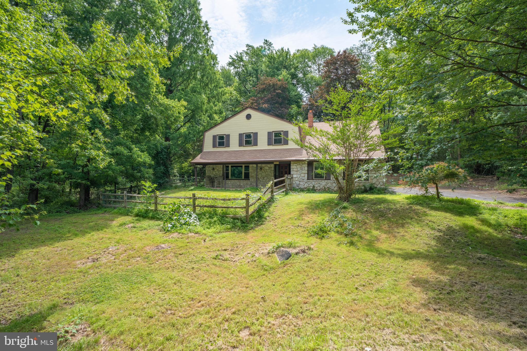 Welcome to 1535 Fieldwood Road--where peaceful living meets everyday conveniences of desirable Southampton! Located in the unique Bryn Gweled Homesteads community, this home offers a one-of-a-kind ownership experience centered around shared green space and a strong sense of community, perfect for buyers seeking something beyond the typical suburban neighborhood. Nestled on almost 2 acres, this property offers a unique blend of privacy and convenience. 
Inside, beyond the foyer, is a large family room, kitchen with two pantry closets, dining room, living room, sunroom, laundry room, a full bathroom, and one bedroom/ living space with its own access exit. On the second floor there is a primary bedroom en suite, three more bedrooms, and a full bathroom. The spacious and flexible layout is ideal  for multigenerational living, work from home needs, or hosting guests. 
Step outside to an expansive lot which provides endless possibilities for  gardening, outdoor entertaining, recreation, and simply enjoying the privacy and natural surroundings. Properties with this kind of space and  land in Upper Southampton are  few and far between.

**Important note: Ownership in Bryn Gweled Homesteads requires membership in the community, which may take approximately 2-3 months to complete. Please visit the homestead's website for more information. There are members who would be  happy and ready to explain the process. Membership comes with abundant rewards--an intentional community of neighbors, beautiful swimming pool, scenic walking trails through protected common land, organic community garden, private pond, creek, sports court, soccer field, and children's play area.