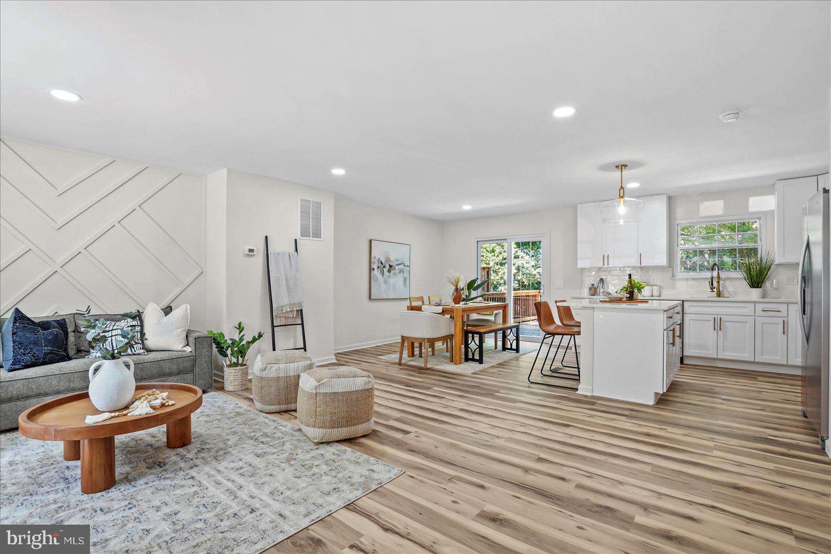 Renovated townhome in the highly sought-after Wellington Valley community! Bathed in natural light, this beautifully updated home features gorgeous luxury vinyl plank (LVP) flooring and a bright, open-concept floor plan designed for modern living and effortless entertaining.

The stunning renovated kitchen is the heart of the home, showcasing quartz countertops, stainless steel appliances, and a spacious center island that seamlessly flows into the dining and living areas. Just off the dining room, step onto the private deck overlooking the fully fenced backyard and mature trees—the perfect setting for morning coffee, outdoor dining, or relaxing with family and friends.

The upper level offers three generously sized bedrooms and two beautifully renovated full bathrooms. The spacious primary suite serves as a private retreat, complete with a spa-inspired en-suite bath designed for relaxation after a long day.

The finished walkout lower level provides exceptional additional living space, featuring a large family room or recreation room, a fourth bedroom, and a stunning full bathroom. With direct access to the backyard, this versatile space is ideal for entertaining, hosting overnight guests, creating a home office, or accommodating multigenerational living.

Perfectly situated in the desirable Wellington Valley community, this move-in-ready home is conveniently located near shopping, restaurants, parks, and everyday conveniences, with easy access to major commuter routes. Offering stylish finishes, flexible living spaces, and an unbeatable location, this home truly has it all.