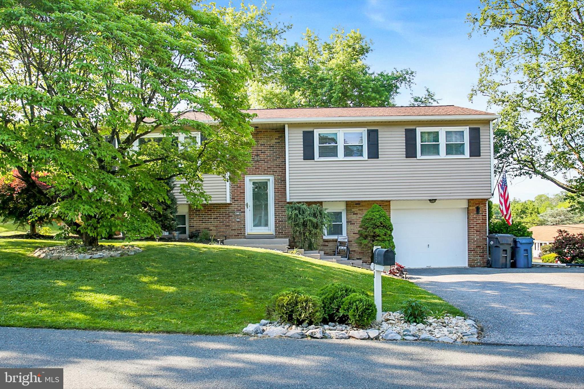 Discover this charming bi-level home in the highly desirable Park Hills West! This well-maintained residence offers over 2,000 square feet of finished living space, perfect for both everyday living and entertaining. Featuring 4 generously sized bedrooms, 3 baths, and an oversized 1-car garage, this home provides plenty of space for everyone. Enjoy relaxing evenings on the beautiful multi-level deck  overlooking the expansive, fully fenced 0.29-acre yard with additional side yard space. The main level features a spacious living room, formal dining room, and an eat-in kitchen, along with 3 bedrooms and 1.5 baths. The lower level offers a cozy family room highlighted by a charming brick fireplace and beautiful LVP wood flooring, plus a 4th bedroom, office, half bath, and a spacious laundry room.
During the current ownership, major updates include a new roof (2021) and new fence (2022) providing added peace of mind. Conveniently located near Routes 15, 581, 83, the PA Turnpike, shopping, grocery stores, and hospitals, this home combines comfort, space, and an unbeatable location!