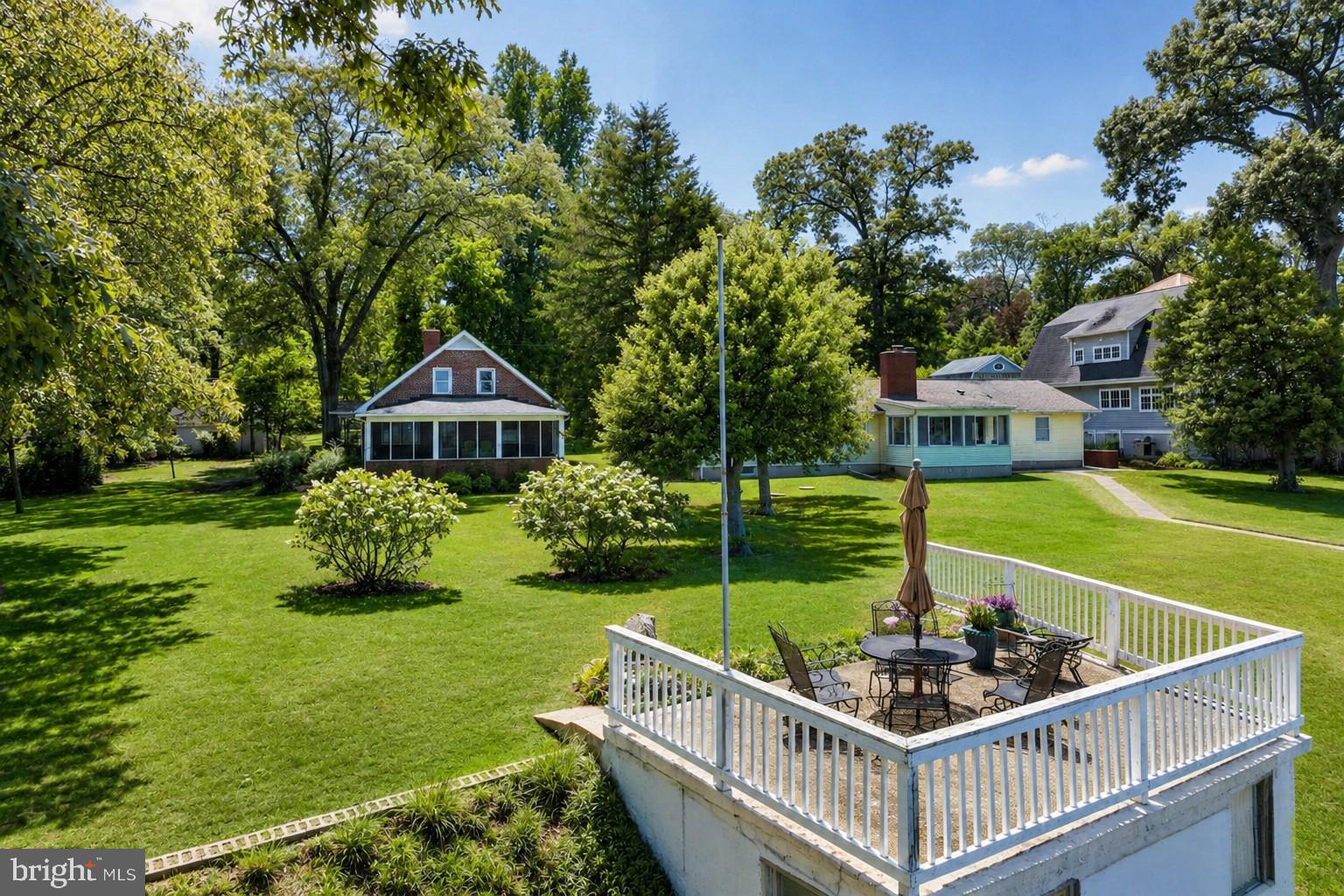 Set on a gracious 1.06-acre lot with sweeping views of the Magothy River, this all-brick two story cottage offers a unique combination of privacy, double lot, and location in the sought-after Shore Acres community. Built in 1956, the home features five bedrooms and two full bathrooms. The large screened porch overlooks the water and the fireplace anchors the home’s living room. The detached garage and additional storage shed add to the existing impervious coverage. The waterfront has two elevated terraces with enclosed storage below, connected by a waterside promenade that runs along the Magothy. This property gives the opportunity to lovingly renovate the existing brick cottage and preserve its charm, or start fresh and build your waterfront dream home. Shore Acres is a voluntary HOA offering a neighborhood beach with picnic tables, community clubhouse and boat ramp access to members ($75/yr).