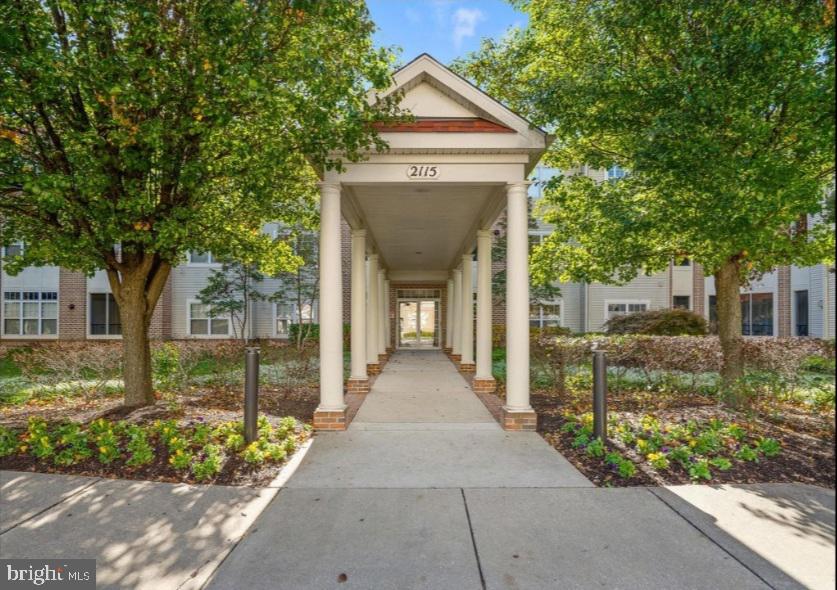 Beautifully Appointed Main Level Condo showcasing nearly 1,600 SQFT of living space! No Age Restriction! Includes One Assigned Parking Space in Lower Level Secured Garage along with a Storage Locker. One of the few Deluxe models available showcasing a split bedroom design for ultimate privacy while offering a central common area for day to day living. Kitchen offers Stainless Steel Appliances, 42" Cabinetry, new Quartz Countertop and backsplash  and adjacent Breakfast Room. A separate Dining Room, Living Room & Bonus Den/Office/3rd BR along with a Screened Porch provide great areas for relaxation & entertaining. The desirable Master Suite features a separate sitting room which can be utilized as an office/nursery/etc., two large closets coupled with a full bath. The 2nd Bedroom, Hall Bath & Laundry/Storage room complete the floorplan. Recent improvements in 2021 include: New Carpet, Fresh Paint throughout, New Microwave & Dishwasher, Kitchen Countertop & Sink. Other Updates: Refrigerator (2018), Stove (2016), HVAC (2019). Parking Space is #3; Storage Bin #111