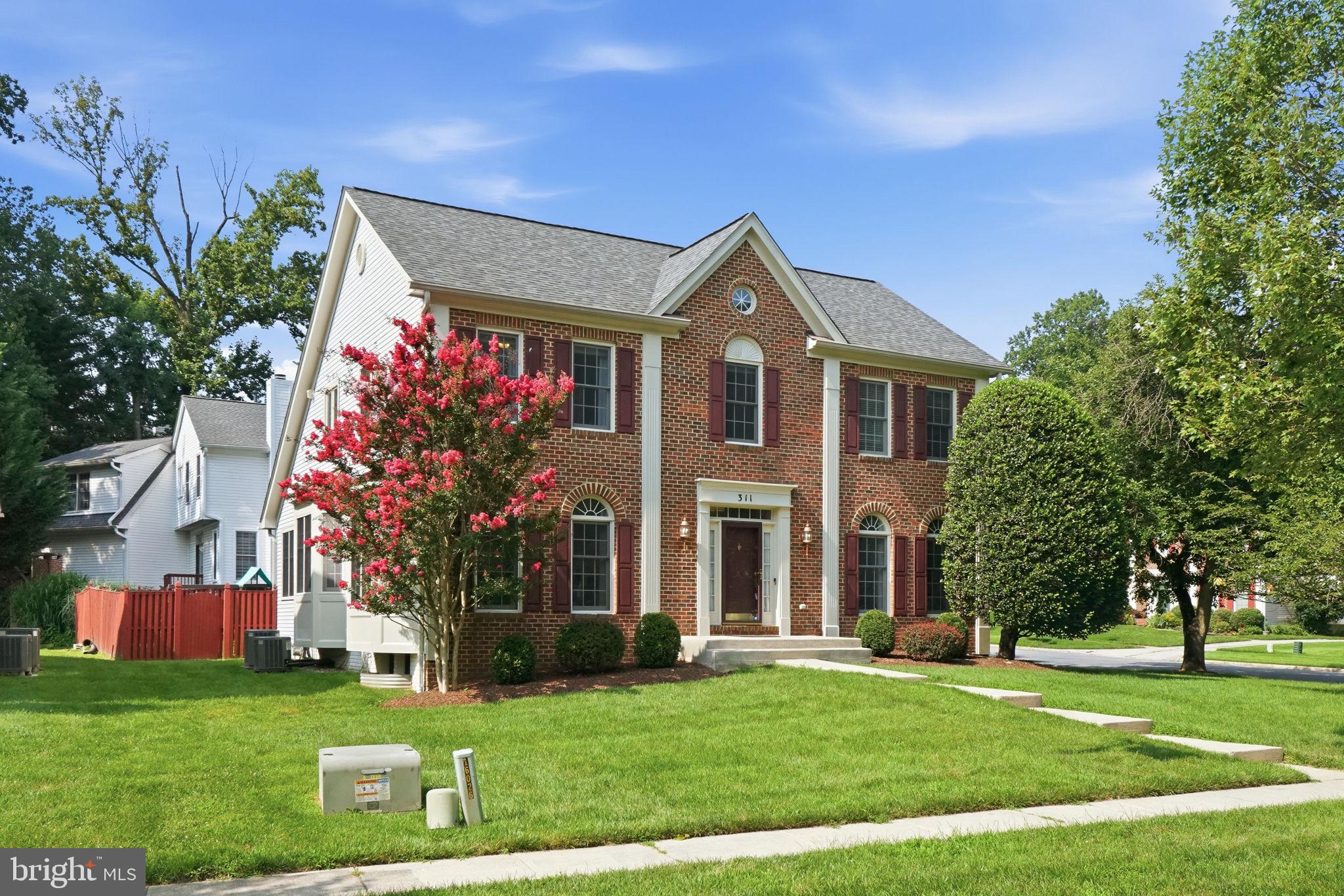 Welcome home to this beautifully maintained 4 bedroom, 3.5 bath colonial on a corner lot in the sought after Nottingham Woods community. Step inside to a welcoming foyer that sets the tone for the thoughtfully designed main level. A light filled formal dining room and living room offer wonderful spaces for entertaining, while a dedicated main level office provides the perfect spot to work from home. Toward the back of the home, the open floor plan connects the kitchen to the family room with newly installed hardwood floors (2025), anchored by a fireplace with custom built in surround shelving. The eat-in kitchen features granite countertops, a gas cooktop, and a double oven (2022). Main level laundry and a mudroom off the 2 car garage round out the everyday convenience, along with a half bath refreshed with a new toilet and plumbing fixtures (2025). Upstairs, the updated owner's primary suite is a true retreat, featuring an updated bath and a massive walk in closet with custom closet systems (2023). Three additional bedrooms and a full bath complete the upper level. The finished lower level offers plenty of living space, with a full bathroom, abundant storage, and a bonus room ideal for a playroom, home gym, or potential 5th bedroom. The fully fenced backyard boasts a deck and playset, both freshly painted in 2025. This home has been thoughtfully updated throughout, including dual AC systems (2022), roof (2019), attic fan (2022), Liftmaster garage door opener (2023), and washer and dryer (2018). Enjoy sidewalk lined streets with access to the Robinhood pool community and easy proximity to Route 200, I-495, shopping, dining, and parks. This one truly has it all.