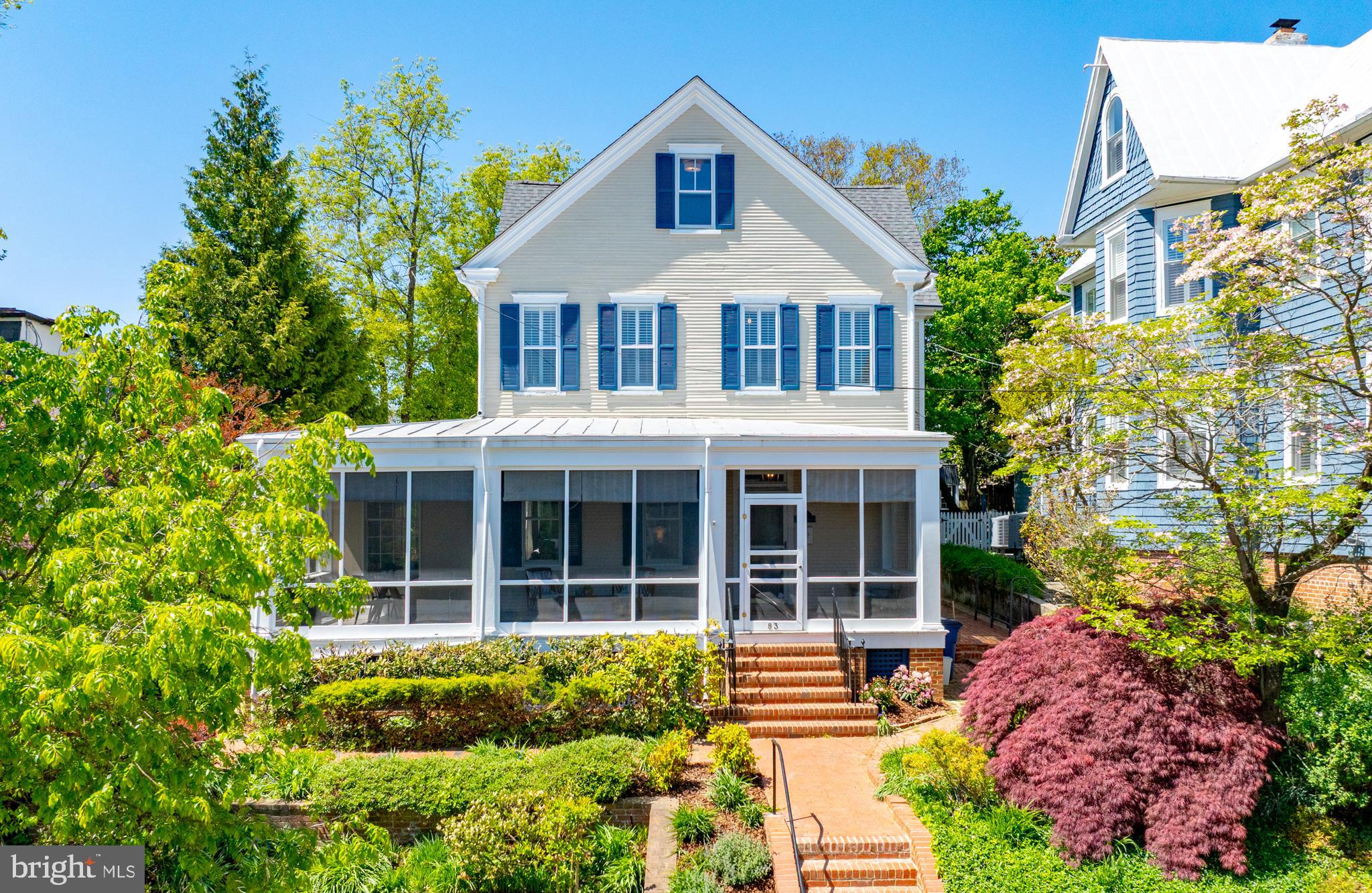 A magazine-worthy Historic District renovation, completed in 2026. Designed by well-known Annapolis architect Jay Schwarz and Clara Rose Interior Design, this home features a brand-new kitchen, wet bar, and fully reconfigured third floor with every detail thoughtfully considered. Water access at the end of the block, Acton's Cove waterfront park around the corner, all of downtown Annapolis within easy walking distance, and easy parking on Market Street round out a lifestyle that's hard to beat.  The kitchen features custom designed cabinetry with Taj Mahal quartzite countertops, ceramic tile backsplash, and unlacquered brass hardware. New lighting from Serena & Lily, Williams Sonoma, and Pooky. All new GE Monogram appliances include a refrigerator, panel-ready dishwasher, six-burner induction range, convection wall oven, and a five-in-one oven that steams, dehydrates, microwaves, convects, and broils. A full pantry with navy cabinetry offers generous storage, a separate freezer, and ice maker. The custom designed bar includes brass railings, reeded glass cabinets, a dedicated sink, and storage for plates, linens, and beverages. Brand-new HVAC.  A full-width screened-in porch spans the entire front of the home. Ten-foot ceilings on the first two floors and period-true character carry throughout. A classic front office with wood paneling and wood ceiling leads to the main living spaces, including a formal family room with fireplace, gracious dining room, and a second casual family room. Seasonal water views can be enjoyed from multiple areas. The eat-in kitchen flows directly to a hardscaped rear patio with gazebo.  Upstairs, the primary suite offers winter water views, dual closets with organizers, and a renovated bathroom. The second bedroom has an en-suite bath, and the second level also includes the laundry room.  The third floor has been completely reimagined with three new rooms that make clever use of the eaves, each with built-in shelving and closets, along with a new full bath featuring black-and-white penny tile mosaic floors and double-stripe wall tile carried to the face of the tub, plus a custom vanity with quartz countertops. A brand-new carpet runner leads up to the third floor, with new carpet throughout the bedrooms.  Don't miss this truly exceptional Annapolis home!