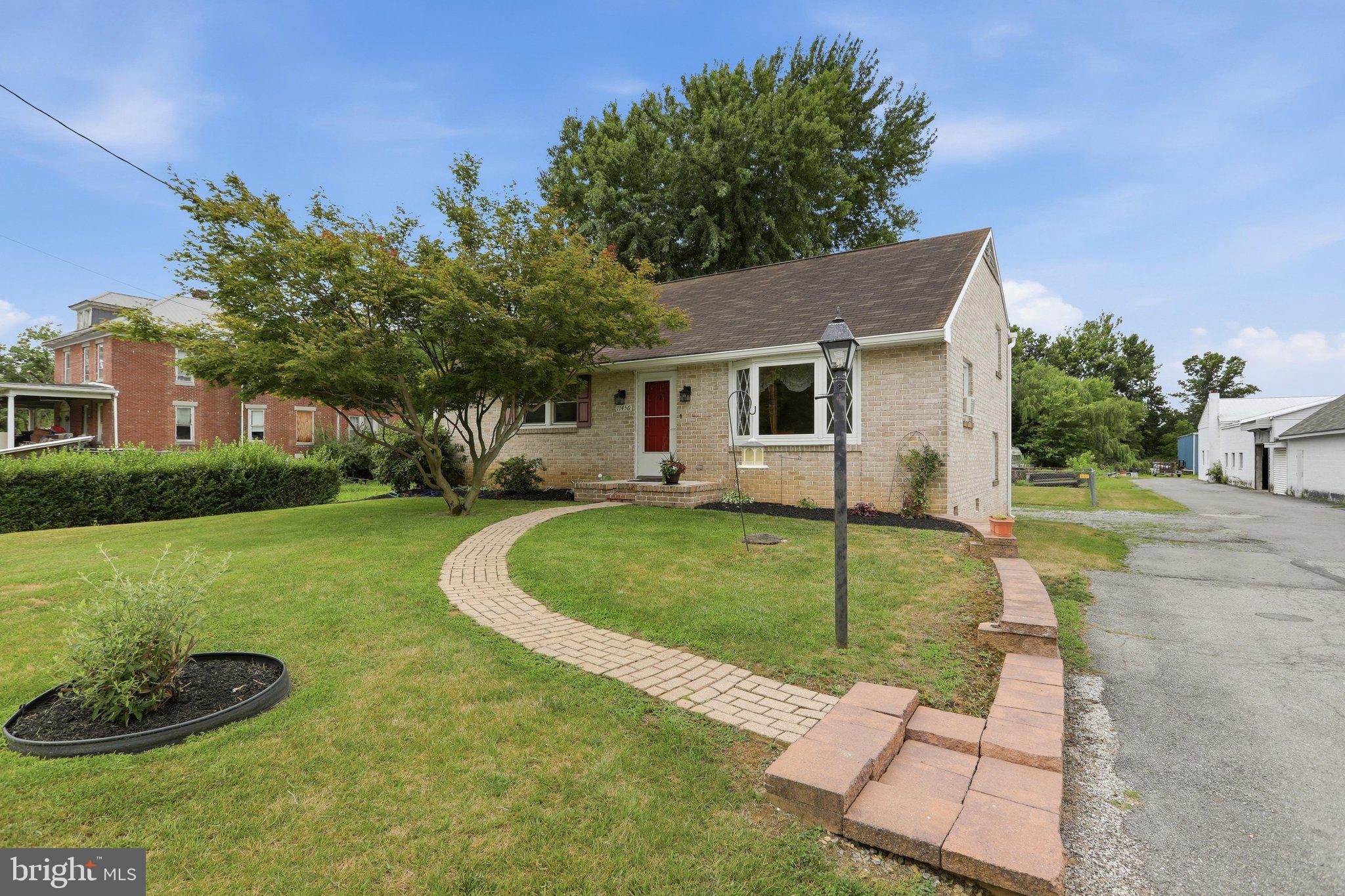 Welcome to this bright and cozy 3-bedroom, 1.5-bath home located just minutes from the Maryland/Pennsylvania line and downtown Waynesboro. Well-maintained landscaping and a paver walkway enhance the home's exterior.

The main level features a kitchen with updated cabinetry and flooring completed in 2020, along with a pantry, ample counter space, and multiple windows that fill the space with natural light. The dining room features a vaulted ceiling, a bay window, and decorative shelving, creating an open and airy setting for everyday dining.

The upper level features all three bedrooms, including the primary bedroom with a private half bath. A full hall bathroom is conveniently located on the same level.

The walk-out lower level features a spacious family room with built-in shelving, a recently updated laundry room with cabinets and a large walk-in closet, a cedar-lined closet, and additional flexible space for storage, hobbies, or future use. Other improvements include a hot water heater installed in 2021.

Step outside to enjoy the fully fenced backyard, complete with an attached outdoor storage area and space for outdoor activities, pets, or gardening. Conveniently located near shopping, dining, parks, schools, and major commuter routes including PA-16 and I-81, with easy access to Hagerstown, Chambersburg, and surrounding areas.