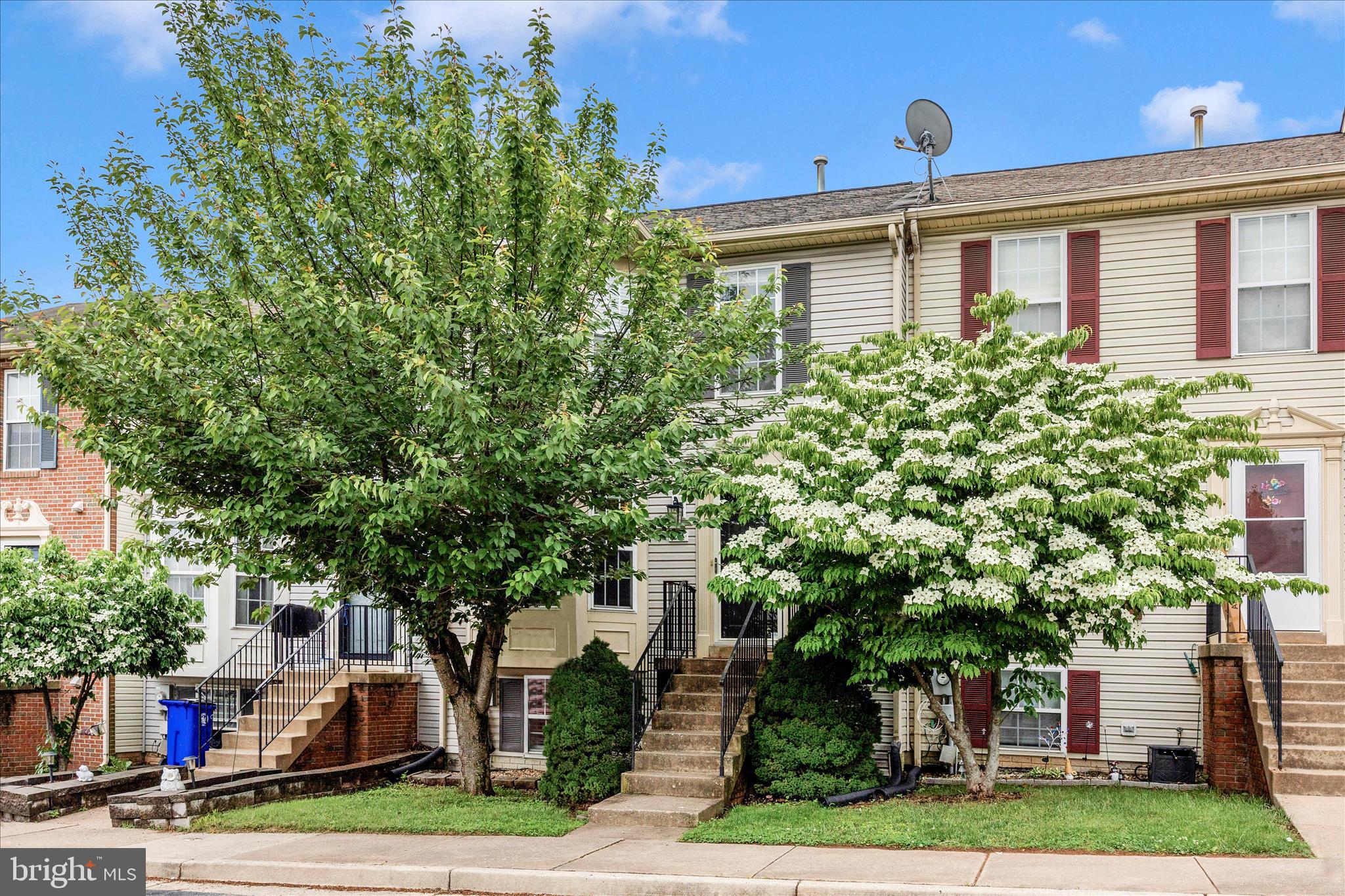 Welcome to 211 Moser Circle—a beautifully maintained three-level townhome offering space, style, and thoughtful updates throughout! From the moment you step inside, you’ll appreciate the warm and inviting feel created by gorgeous wood flooring that flows across both the main floor, complemented by decorative moldings that add character and charm. The main level features a spacious living room, half bath, dining area, and kitchen, creating an ideal layout for both everyday living and entertaining. The kitchen is well-appointed with granite countertops, stainless steel appliances, and convenient access to the rear yard. Upstairs, you’ll find comfortable bedroom spaces, including a generous primary suite with a private ensuite bath and large closet, offering a peaceful retreat at the end of the day. The finished lower level expands your living space with a cozy family room, fourth bedroom, half bath, and a dedicated laundry area. Brand new carpet adds comfort and a fresh feel to this level. Step outside to enjoy the fenced rear yard, providing privacy and a great space for outdoor enjoyment. The home also includes two assigned parking spaces for added convenience.  Major updates offer peace of mind, including a new roof (2024), water heater (2025), and new garbage disposal (2026). This move-in ready home combines comfort, functionality, and value—don’t miss your opportunity to make it yours!