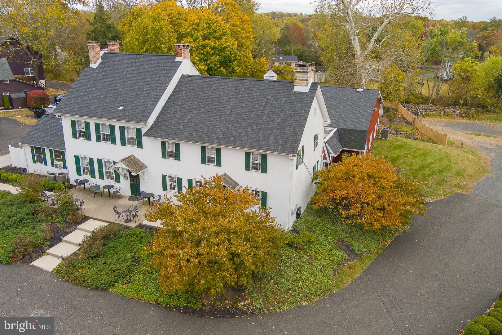 Own a piece of history at this charming and elegant event venue in the heart of Chalfont, Bucks County. With nearly 8,500 sq ft on  3 picturesque acres, this property blends 18th-century character with modern amenities. Built in 1720 by Simon Mathews, one of Chalfont’s founders, it offers a rare opportunity to bring your hospitality vision to life.

The main level features a rustic bourbon bar and a recently improved grand ballroom that accommodates up to 280 guests. Highlights include exposed wood trusses, vaulted ceilings with skylights, LED-lit crown molding, a spacious dance floor, an additional bar, and a large commercial kitchen with two walk-ins, multiple prep areas, and ample dry storage, truly ideal for a turnkey wedding, event, or catering operation.There is also a wheelchair lift for full ADA compliance

The upper level offers two versatile rooms, previously used as bridal and groom suites, along with a fireplace, kitchen, full bath, and additional office area.

Outdoor amenities include a fenced event space with a gazebo, deck, and patio, perfect for ceremonies or cocktail parties.

With numerous updates throughout, this well-maintained historic venue is poised for continued success. The property also offers the potential for further development, including a small 60 unit hotel, making it an exceptional opportunity for a long-term, full-service hospitality destination.