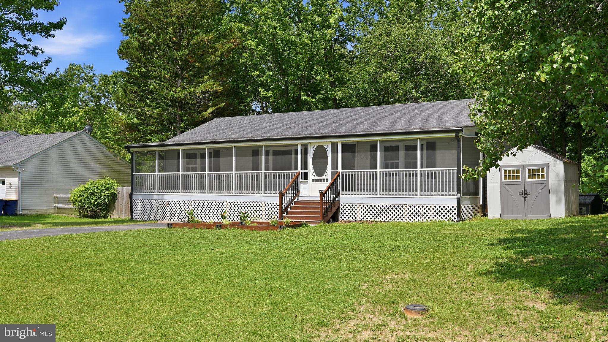 Welcome home to this beautifully updated 3-bedroom, 2-bath rambler perfectly situated on nearly half an acre at the end of a quiet cul-de-sac with NO HOA! Offering the ideal blend of comfort, privacy, and convenience, this move-in ready home is filled with upgrades and thoughtful features that today's buyers are searching for.  Step inside to discover fresh paint, premium flooring, and an inviting open layout designed for everyday living and entertaining. The spacious family room flows seamlessly into the large eat-in kitchen, where you'll find granite countertops, stainless steel appliances, a pantry, abundant cabinet and counter space, and a refrigerator that's only two years old. Retreat to the spacious primary suite featuring a walk-in closet and a private bath with double vanities and a beautifully tiled shower. Two additional generously sized bedrooms each offer their own walk-in closet—an uncommon feature that provides exceptional storage throughout the home. The secondary bath has also been tastefully updated.
Outdoor living truly shines here! Start your mornings with a cup of coffee on the spacious screened-in porch, spend evenings entertaining on the expansive deck, or simply relax and enjoy the peaceful, tree-lined views from your fully fenced backyard. With plenty of room to garden, play, gather with friends, or enjoy your favorite outdoor hobbies, this private retreat offers the perfect backdrop for everyday living.
Animal lovers will appreciate the established chicken coop, while two storage sheds provide exceptional flexibility. The rear shed has been insulated and outfitted with electricity and lighting, creating the ideal space for a workshop, hobby room, gardening headquarters, or additional storage. Thoughtfully designed for both relaxation and functionality, this outdoor oasis is ready to fit your lifestyle. Additional features include a separate laundry room with GE washer and dryer, new gutters, and a roof and HVAC system that are approximately nine years old, providing added peace of mind. Ideally located just minutes from shopping, dining, Route 3, and I-95, you'll enjoy the perfect balance of privacy and convenience. With its spacious lot, thoughtful upgrades, versatile outdoor spaces, and NO HOA, this is the kind of property that rarely comes along. Don't miss your chance to call it home! Some photos virtually staged.