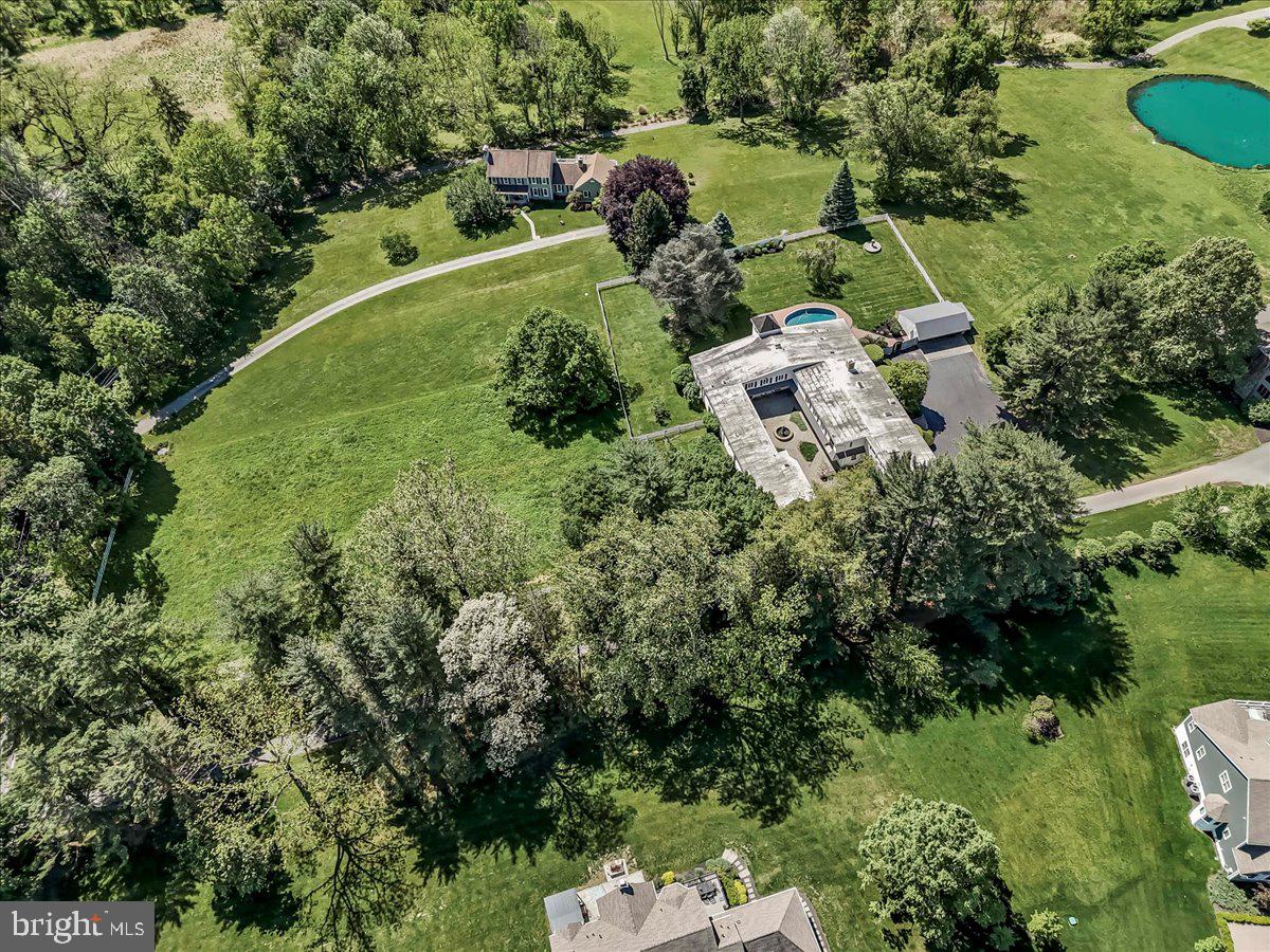 Own a piece of Chester county history on this legacy property in the highly acclaimed West Chester Area School District (Rustin/Stetson/Starkweather).  At one time this unique residence served as the stables of the Rokeby Stock Farm. It is now a modern home sited on 2.8 acres. Accessed by a private drive, 1 Huntrise Lane is available for sale for the first time in over 15 years. This property has been lovingly and carefully renovated by its current owners, including major investments like geothermal heating and cooling, structural enhancements, a whole house generator, new windows and doors,  functional wood burning fireplaces, and modern kitchens and bathrooms.  Visitors can enter via majestic French doors or from the historic iron gates into a stunning courtyard with fountain.  Inside the home, you will be impressed by the open concept design, including the original beams and repurposed wood accents. Custom millwork, soaring ceilings, and rich hardwood floors accommodates grand scale entertaining as well as daily living. The primary kitchen addresses your modern culinary needs with an abundance of storage and countertop area. There is also a “bar kitchen” between the first floor family room and the billiard room, and steps from the pool and patio.  An elegant open stairway takes you to another family living area, which includes 5 bedrooms and an open family/game area, in addition to the laundry room and an in-law suite.**There is a chairlift at this staircase which can remain in place, or can be removed with no damage to the stairs. Ask for Photo.**There are many unfinished interior areas to the property allowing the next owners to customize and utilize the space for their personal and/or professional needs.**NOTE the low property taxes.**Despite its private locale, Huntrise Lane is surprisingly convenient to West Chester Borough, and to an abundance of shopping necessities (Giant, Wegmans, Whole Foods, Costco, Target, Terrain, Starbucks and more within 2 miles) and commuting routes. Only minutes from routes 202, 322, and US-1/Baltimore Pike.**Huntrise Lane is a private drive enjoyed by only 4 residences. Please do not access the lane without an appointment. All showings must be provided by the listing agent or the Seller, so please allow ample notice on showing requests.**