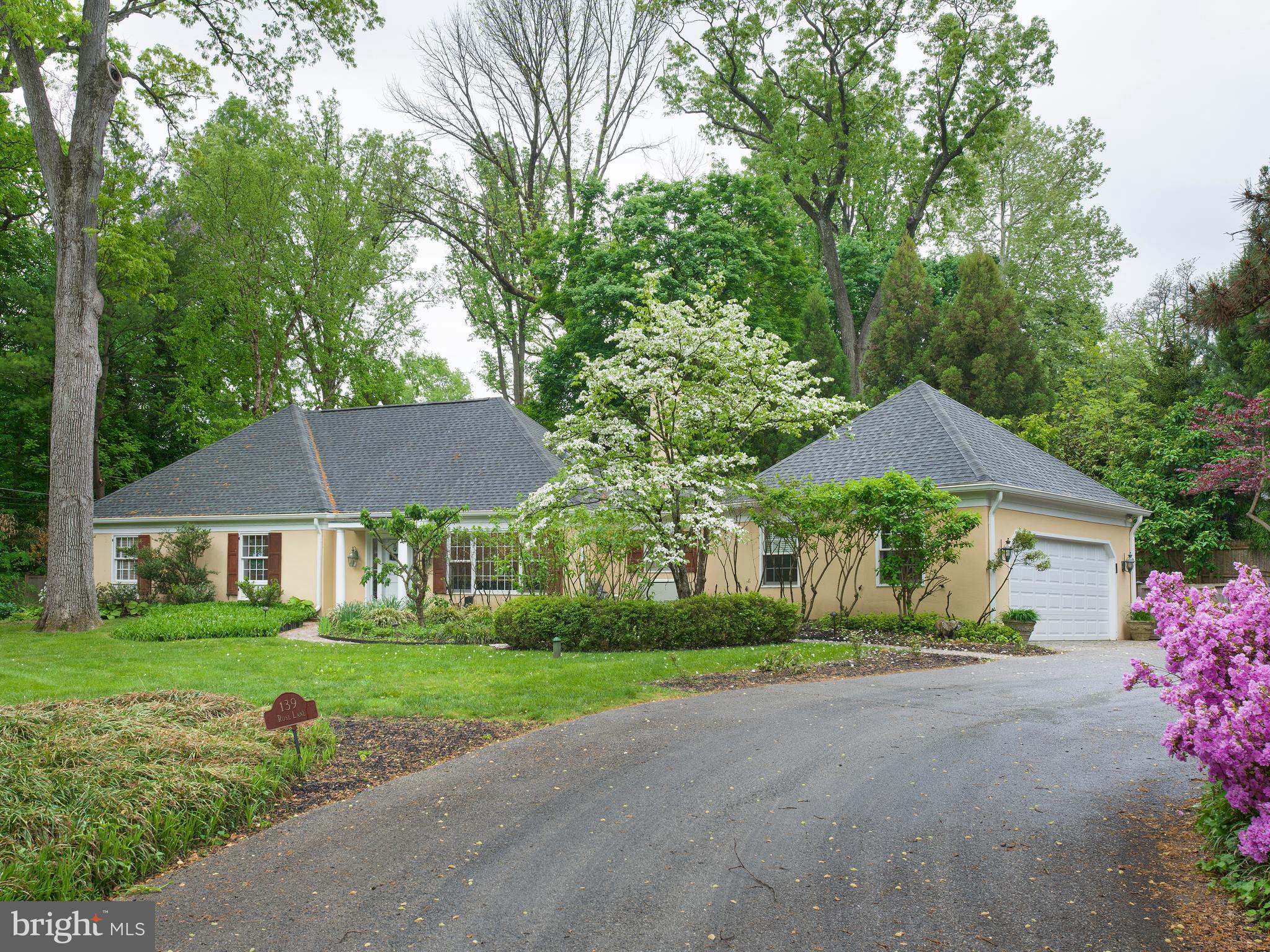 A Private Sanctuary, in the heart of Haverford,
tucked away at the end of a long private drive, this exceptional residence offers a rare combination of privacy, elegance, and walkable Main Line convenience—just moments from the Haverford Train Station, fine dining, upscale boutiques, gourmet markets, and the prestigious Merion Cricket Club.
Thoughtfully designed for effortless first-floor living, the expansive main-level owner’s suite serves as a luxurious private retreat, complete with a custom walk-in closet and a spa-inspired marble bath featuring dual vanities, a steam shower, and radiant heated floors. French doors open directly to a beautifully landscaped paver patio with a resort-style pool and jacuzzi, creating a serene setting for morning swims or evenings spent relaxing beneath the stars.
At the heart of the home, the newly renovated kitchen is both sophisticated and inviting, illuminated by a dramatic skylight and appointed with premium stainless steel appliances, a substantial honed quartzite island, and seamless access to an outdoor terrace—perfect for al fresco breakfasts or afternoon tea.
Upstairs, three additional bedrooms provide comfort and versatility for family and guests, accompanied by a striking white marble hall bath with a soaking tub and glass-enclosed shower.
Wide-plank hardwood floors throughout the main level lend warmth and timeless character, while the lower level offers a temperature-controlled wine room with an adjoining lounge—an intimate and refined space for entertaining or quiet evenings at home.
A truly one-of-a-kind offering, this distinguished residence embodies the very best of privacy, luxury, and convenience in one of the Main Line’s most coveted settings. Welcome to 139 Rose Lane.