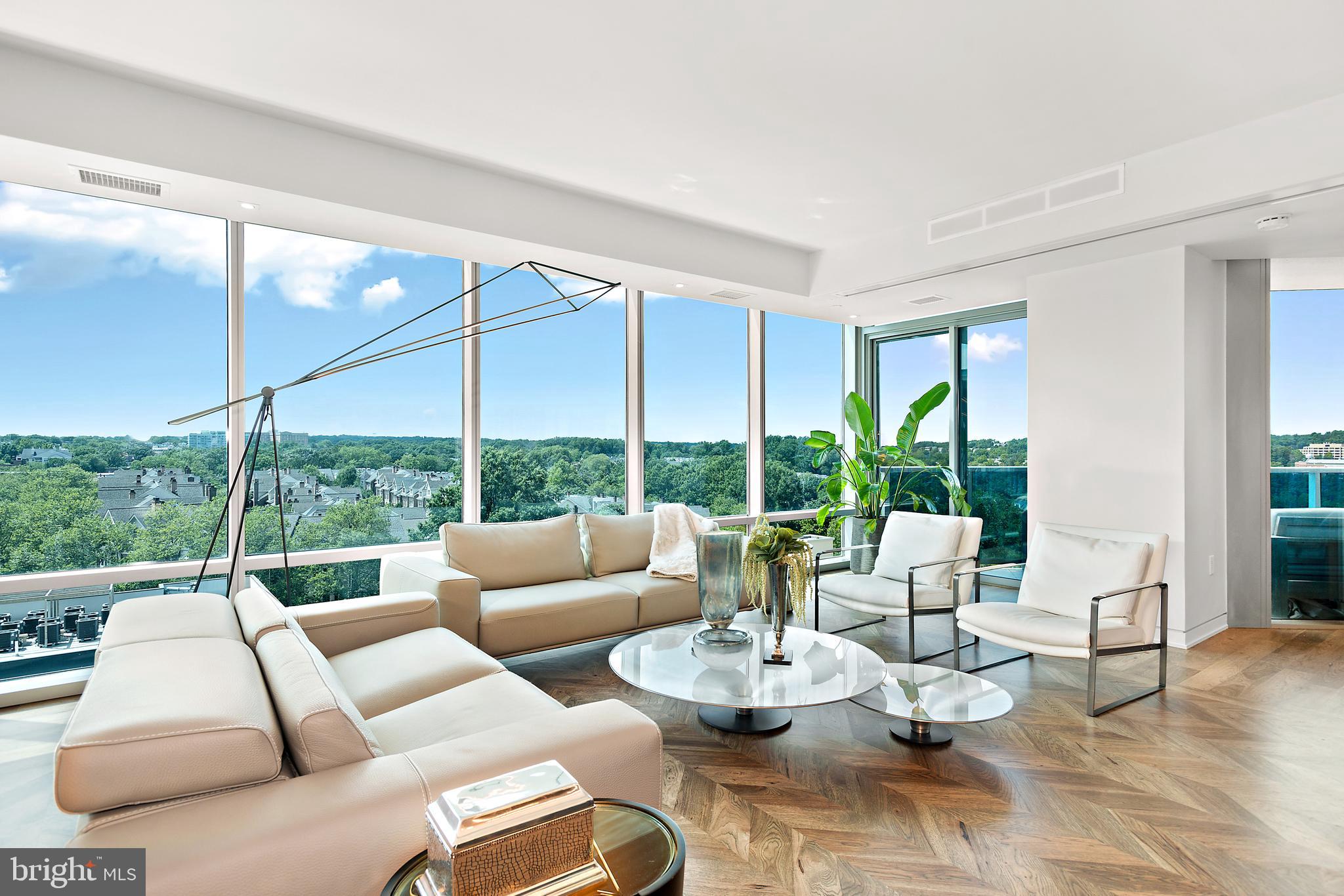 Stunning one-of-a-kind condo in sought after Turnberry Tower.  Top-to-bottom renovation includes new kitchen (cabinets & appliances), bathrooms, flooring, lighting & doors.  Enter the condo directly from the elevator  in to a private foyer with smoked glass wall.  The striking custom kitchen features dramatic black cabinets, top-of-the-line appliances and marble waterfall countertops.  Hickory floors, laid in a herringbone pattern in the foyer & living areas, add warmth to the space . The owner's suite includes two spacious custom closets (one walk-in), access to one of two balconies and a gorgeous marble bathroom with heated floors,  floating vanity, walk-in shower and free standing tub.  The second bedroom also has direct access to a balcony, custom closet and marble bath.   The condo is enhanced with programmable Lutron lighting, projector with drop down screen and custom automatic curtain/shades.  Gorgeous sunsets views over the treetops of north Arlington.   The Turnberry, a full service building with luxury amenities includes; valet parking, gym, indoor pool, spa, yoga room, party room, media room, 24 hour security, concierge, on site management all within walking distance of Georgetown.