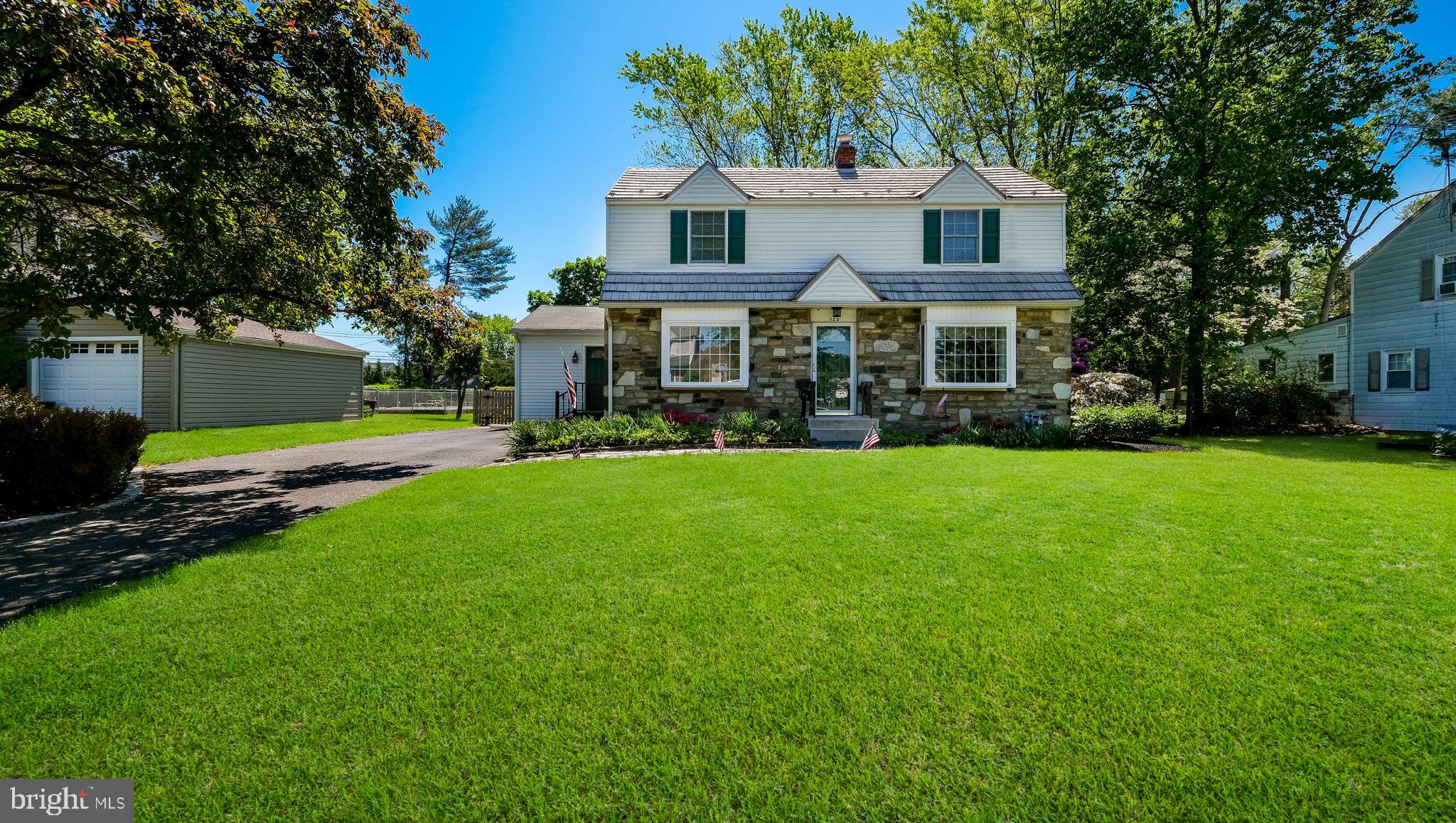 Beautiful 4 BR, 2 full BA, 1/2 stone front Center Hall Colonial features a large center entry opening into the formal Living room with large box bay window, wall-to-wall carpet over parquet oak floors. The Living room opens to the Dining room with chair rail with large box bay window & double hung side window inviting in the morning sun.Hallway off dining room opens to Full hall bath features a 1-piece shower, single vanity & toilet and a large linen closet with bifold doors and separate laundry closet with full size washer & dryer. Living room opens into the Family room & Kitchen addition with wall-to-wall carpet, ceiling fan, double closet & large bay window with view of the backyard. Family room opens to the Kitchen featuring solid cherry cabinetry, granite countertops, stainless steel appliances including a gas range with built-in overhead microwave & built-in dishwasher. Peninsula with pendant lighting overlooks the eating room. Kitchen and eating rooms both feature LVP flooring Atrium door off back of kitchen to large pressure treated deck. Hall off of family room addition opens to 1st floor Primary Bedroom addtion with cathedral ceiling, ceiling fan and 2 oversized windows. Staircase in Living room leads to 2nd floor with wall-to-wall carpet 3 nice sized bedrooms with exposed parquet oak floors & ceiling fans in 2nd & 3rd bedrooms. Unfinished Basement. Freshly painted. Replacement windows throughout. Vinyl siding. Large double driveway with separate door to hall leading to Family room & Primary Bedroom. Gas forced air heat & central air.