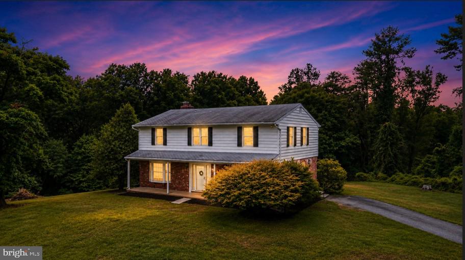 Welcome to 6890 Norris Lane, a truly exceptional property nestled on 5 private acres surrounded by the breathtaking beauty of Patapsco State Park. This stunning 4-bedroom, 2.5-bath home offers the perfect combination of privacy, space, and modern comfort, creating a peaceful retreat while remaining conveniently located near major commuter routes, shopping, dining, and recreation.

From the moment you arrive, you'll appreciate the tranquil setting and picturesque surroundings. Inside, you'll find spacious living areas filled with natural light, a thoughtfully designed floor plan, and generous room sizes perfect for both everyday living and entertaining. The inviting kitchen flows seamlessly into the main living spaces, while the comfortable family room provides the ideal place to relax and unwind.

Upstairs, the spacious primary suite offers a private retreat complete with an en-suite bath, while three additional bedrooms provide ample space for family, guests, or a home office.

Step outside and experience your own private oasis. Whether you're enjoying morning coffee overlooking the wooded landscape, hosting gatherings, or exploring the miles of nearby hiking and biking trails, this property offers an unmatched connection to nature. With five acres of privacy and the beauty of Patapsco State Park at your doorstep, opportunities like this are truly rare.

If you've been searching for the perfect blend of peaceful country living with convenient access to everything Central Maryland has to offer, 6890 Norris Lane is the home you've been waiting for.