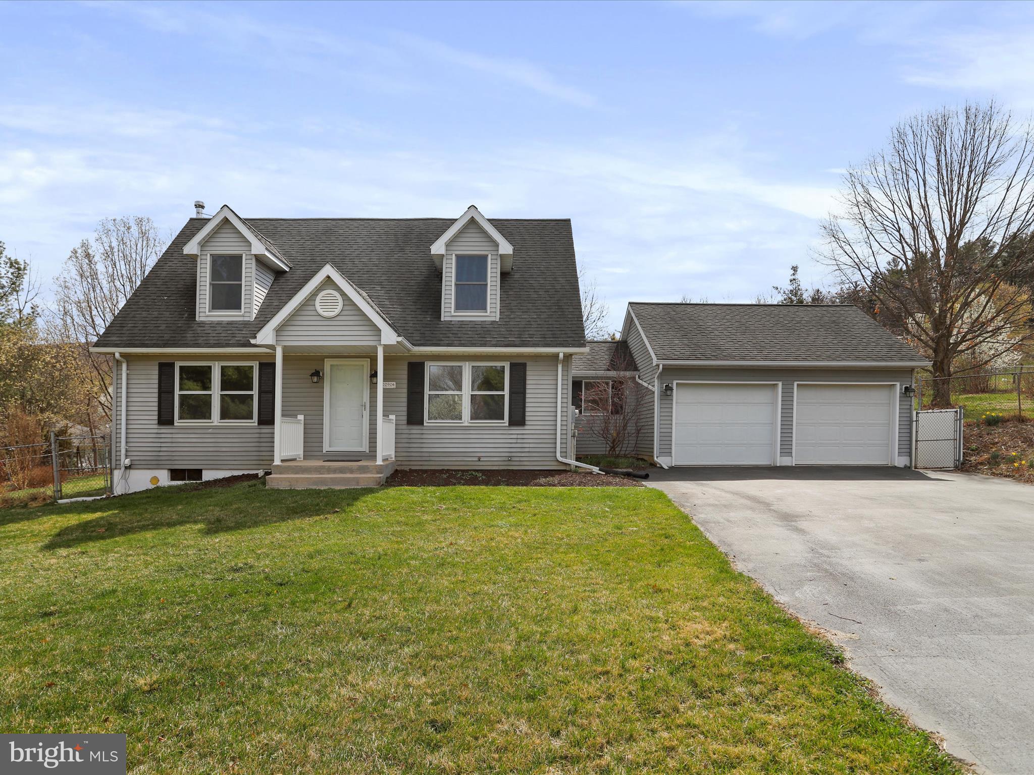 This 3 bedroom, 2 bathroom cape cod has been nicely renovated and is ready to call home! Two car garage enters into a mudroom/laundry room. Main level also features a kitchen with eat in area - with new white shaker cabinets and granite counters, family room, dining/living room/or office, bedroom, full bath with a tub shower.  Second floor features 2 bedrooms and a full bath in hallway with a tub shower. Basement is unfinished and great for your storage needs. Backyard is fenced and has a patio with a pergola.  1 Year Home Warranty included.