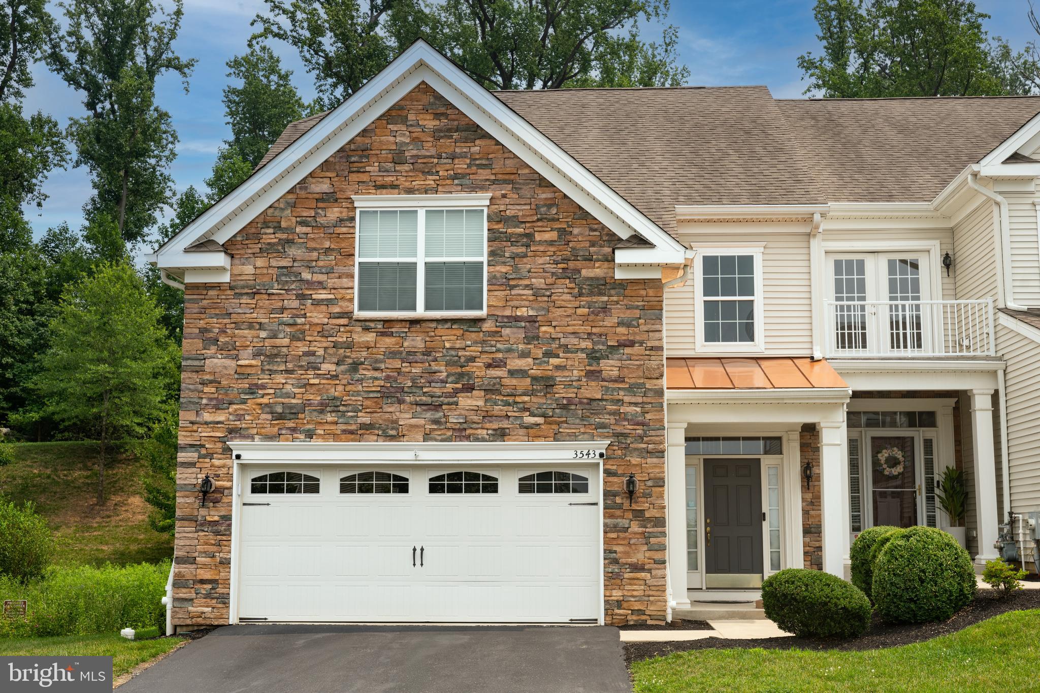 Welcome to this beautifully appointed 4-bedroom, 3.5-bath end-unit townhome in the highly desirable Muirwood Hill community, ideally located in the heart of Newtown Square. Offering the perfect blend of style, comfort, and functionality, this move-in-ready home with a stunning first-floor primary suite has been thoughtfully enhanced throughout.

A dramatic two-story foyer with a graceful turned staircase creates an impressive first impression. The open-concept main level is ideal for both everyday living and entertaining, featuring a stunning kitchen with an oversized island, quartz backsplash, stainless steel appliances, and abundant cabinetry that flows seamlessly into the dining and living spaces. The sun-filled living room is anchored by a cozy fireplace and opens to an expansive Trex deck with a custom retractable awning, an inviting outdoor retreat overlooking peaceful, tree-lined views. 

Conveniently located on the main level, the spacious primary suite serves as a private sanctuary featuring a beautifully updated spa-inspired bath with a newly replaced walk-in shower, dual vanities, and two custom walk-in closets designed for exceptional organization. 

Upstairs, a versatile loft offers the ideal space for a second family room, media area, or home office and showcases a custom-built entertainment center with integrated storage. The generously sized bedrooms provide flexibility for family, guests, or work-from-home needs. Every bedroom has been upgraded with custom blackout and weather-sealing shades and new ceiling fans for year-round comfort. One bedroom currently functions as a home office and features a custom-built queen Murphy bed with integrated shelving, allowing the space to easily transition into a welcoming guest suite. An additional finished bonus room provides valuable flex space for incredible storage, hobbies, or a quiet sitting area.

The fully finished lower level significantly expands the home’s living space with a large bedroom, full bathroom and endless possibilities for a media room, recreation area, play area, or guest retreat. Recent projector wiring and a dedicated projector outlet create a true home theater experience.  Recent improvements to the home include a new HVAC system, custom closet systems, updated lighting, and a 240V EV charging outlet in the attached two car garage, providing added value and peace of mind.

Conveniently located just minutes from the Village at Ellis Preserve, shopping, dining, major commuter routes, and Philadelphia International Airport, this exceptional home offers low-maintenance luxury living in one of Newtown Square’s most sought-after communities.