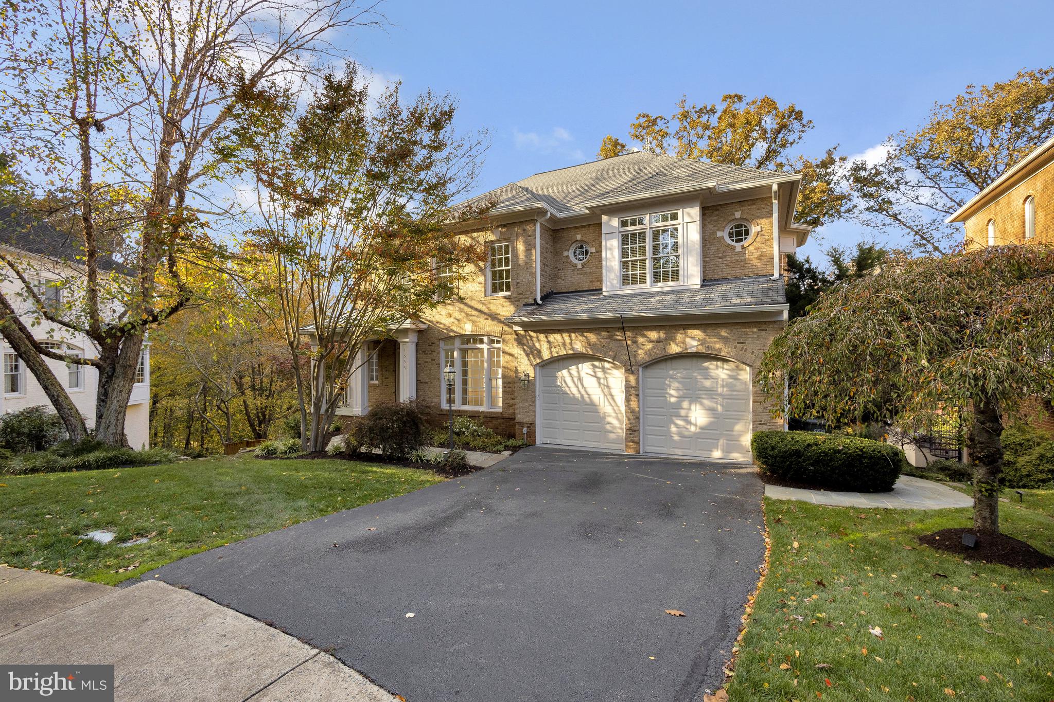 Welcome to 1553 Dominion Hill Ct., a magnificent estate that exemplifies the epitome of luxury living in the heart of McLean.  Nestled in a prestigious and private enclave, this exquisite residence offers an unparalleled blend of opulence and comfort, boasting the finest craftsmanship and attention to detail.  Note the  elegant design and architecture   This stately home features an elegant Colonial-style design with a timeless red brick façade, a grand entrance portico, and beautiful  landscaping. The exterior is complemented by classic white columns, creating an inviting and regal first impression. As you step inside, you'll be greeted by an enticing floor plan with  intricate millwork, and gleaming hardwood floors, setting the tone for the luxury that awaits within. This home offers spacious and versatile interiors .  The grand layout spans over 5,500 square feet, offering generous spaces for both relaxation and entertainment. A formal living room  and a sophisticated dining room provide the perfect setting for hosting guests and special occasions. The enormous executive  home office makes working from home a delight!  The open-concept kitchen is a chef's dream, featuring top-of-the-line appliances including a warming drawer and two dishwashers, a center island, and an adjacent breakfast area that opens to a cozy family room with fireplace.  Access to the deck for easy grilling and relaxing is found here off the huge breakfast room.  The kitchen also provides access to the back stairwell up to the bedroom level. A full bathroom completes the main level.  Upstairs you will find sumptuous bedrooms and serene retreats .  
The upper level is dedicated to the primary suite and additional bedrooms. The primary  suite is a true retreat with a private sitting area, a peninsula fireplace, and double walk-in closets, The luxurious spa-like primary bathroom boasts a soaking tub, a luxurious steam shower and a private water closet. The second bedroom has an en-suite bathroom and the third and fourth bedroom share a large Jack-and-Jill bathroom. The upper level also houses the terrific laundry room with a tub sink and storage. The lower level is its own special place. Enjoy this space for entertainment galore or let your guests have a private retreat of their own!  There is  a separate recreation room complete with a stone fireplace and gorgeous bar. There is an additional bedroom that is uniquely bi-level and offers built-ins, a sitting room or office  and tray ceilings. There is also a great home gym on this level in addition to a separate large storage room. The lower level has tons of natural light with its 12' ceilings and walls of windows, it is truly spectacular.  The exterior of the home features not one, but two large, elegant  decks for relaxing and entertaining, backing to Pimmit Run Stream for exceptional outdoor living. 1553 Dominion Hill Ct. is a premiere location,  ideally situated near the heart of McLean, providing easy access to the area's top-rated schools, upscale shopping, fine dining, and the vibrant cultural scene.  There is easy access to the Metro and the major commuting routes making this location a commuter's dream.