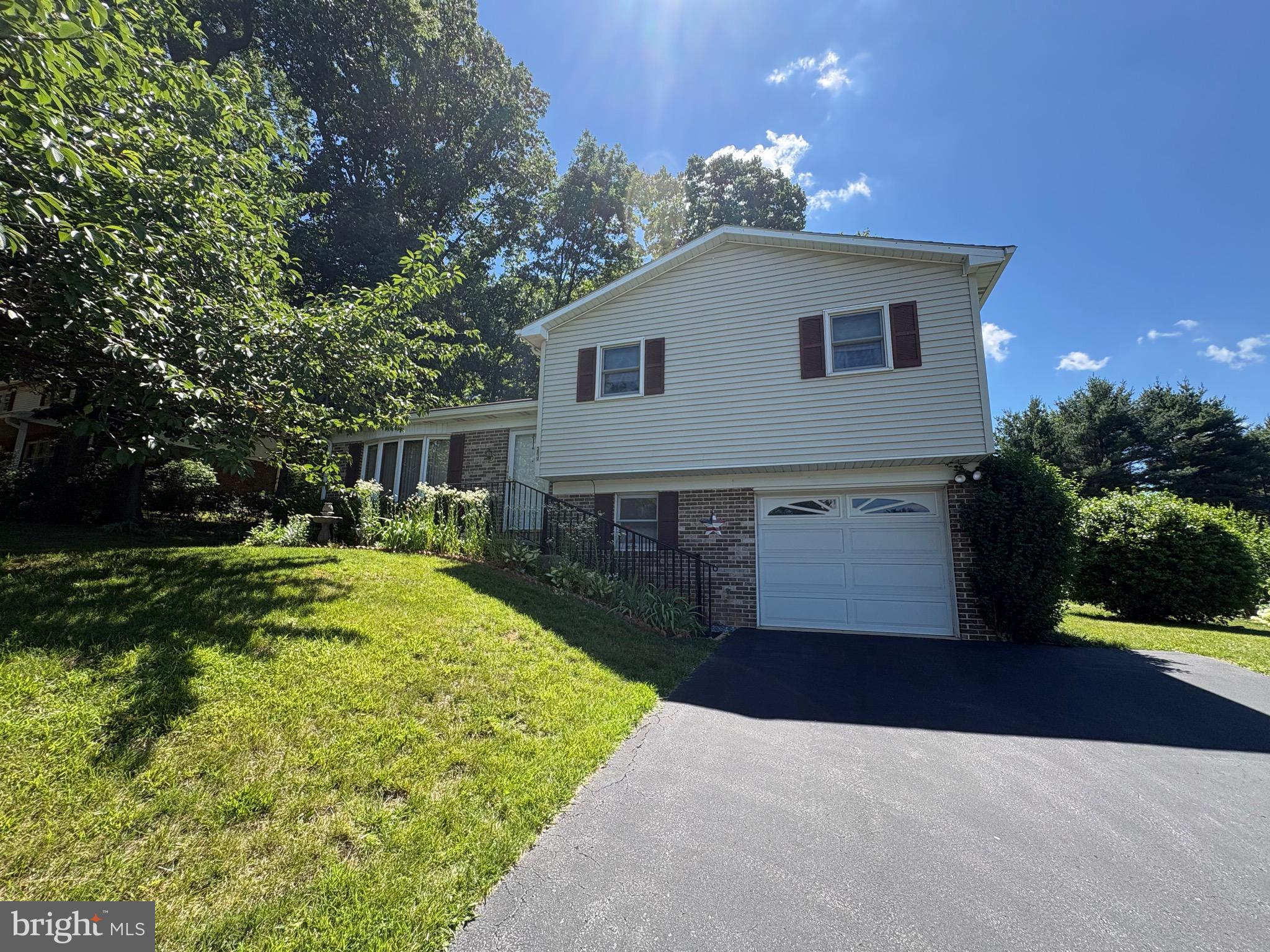 Well-maintained 4-level split offering space, comfort, and a beautiful outdoor setting. Enjoy the inviting 3-season room overlooking a mature backyard featuring a patio sitting area, shaded retreat, two storage sheds, and an abundance of established perennials that provide color and enjoyment throughout the seasons.
The interior has been lovingly cared for and features 3 bedrooms and a full bath on the upper level. The main level offers a spacious living room, dining area, and a country-style kitchen perfect for everyday living and entertaining.
The lower level includes a cozy family room with a wood-burning stove, plus convenient access to the attached garage. An additional bonus level provides flexible space ideal for a recreation room, media room, home office, or man cave, along with access to the laundry area and utilities.
Located in a beautifully maintained neighborhood, this home offers easy access to commuter routes, shopping, and the popular Amish Market. A wonderful opportunity to enjoy comfortable living in an established community
