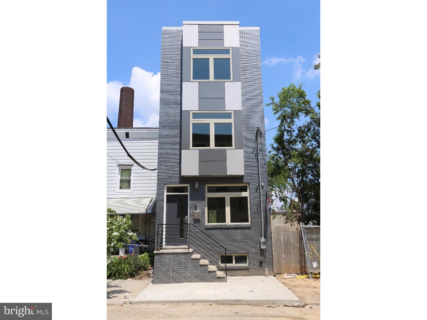 A New Construction property in Fishtown/East Kensington with over 3,000 square feet of living space. The main features include a 10 year tax abatement, 3 bedrooms, 3 baths, a sky line panoramic roof deck, full finished basement, upper levels sq ft 2,800, upper floor laundry. Finished basement is partially above ground filling it with natural day light, modern tile floors, recessed lighting, and custom iron railings throughout the home as well as a custom tile Full Bath with rolling glass enclosed shower, pebble floor, and floating vanity (throughout). Open living and dining room, open kitchen with glass subway back splash and stainless appliances, and recessed lighting (throughout). The upper floor bedrooms have ample natural lighting with large closets. There is a laundry room with washer and dryer included. The 3rd floor master with en suite master bath, rolling glass enclosed shower and dual sinks is stunning. Roof deck access from the hall with amazing views.