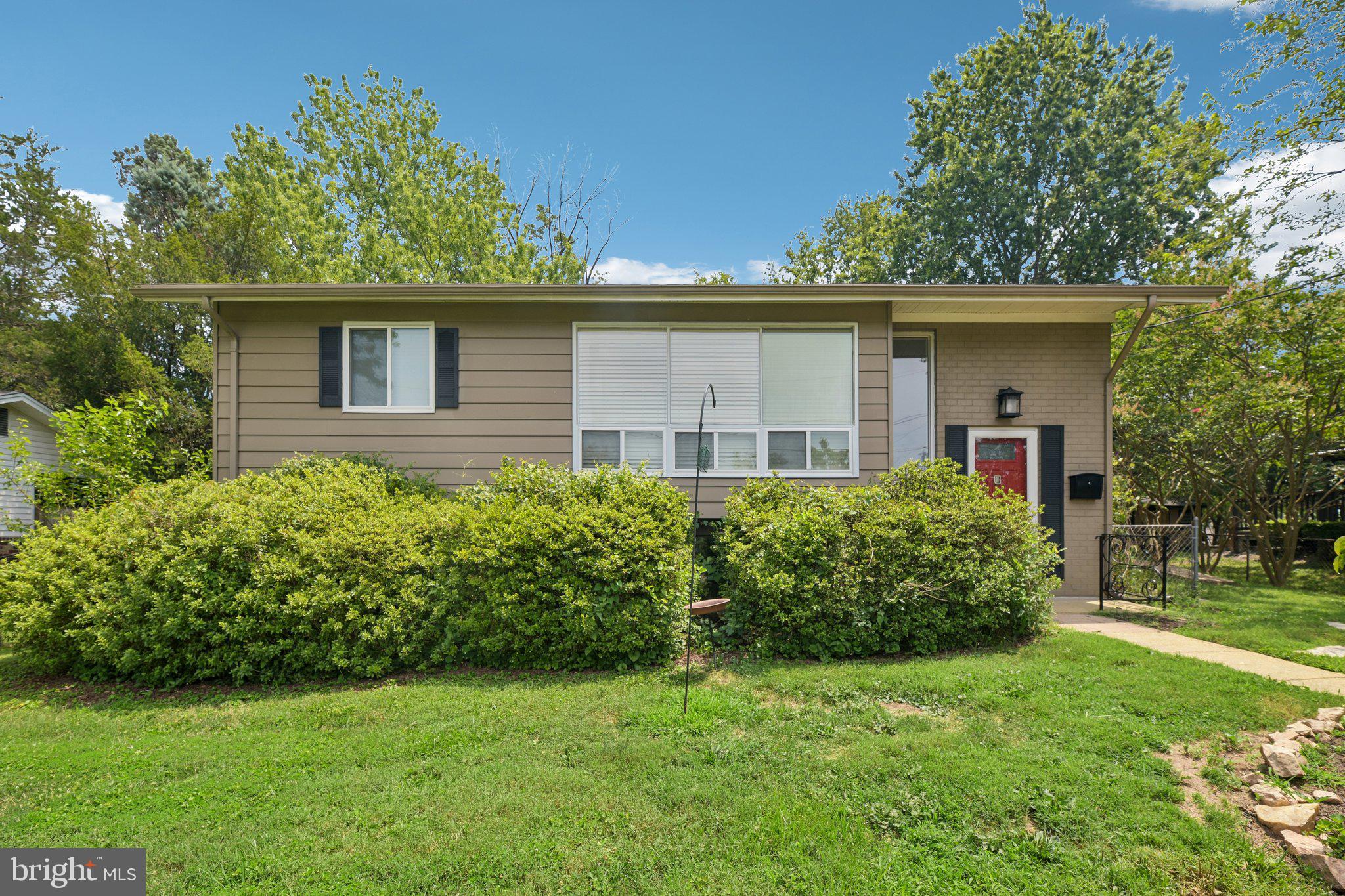 Welcome to 4957 Regina Drive, a beautifully maintained 3 bedroom, 2 bathroom single-family home perfectly positioned at one of the highest points in the neighborhood, offering peaceful hilltop views, stunning sunsets, and a setting that feels tucked away while remaining incredibly connected to everything Northern Virginia has to offer.

From the moment you step inside, you’ll appreciate the warmth, quality, and thoughtful improvements throughout this solidly built home. The updated kitchen was designed with both style and functionality in mind, featuring GE Monogram double convection ovens, a Bosch dishwasher, induction cooktop, and an abundance of smart storage solutions, including convenient lower drawers in place of traditional cabinets for easier everyday living.

The home has been lovingly cared for with major updates already completed, including a new kitchen (2016), beautifully renovated bathrooms (2019), finished basement build-out (2019), refinished hardwood floors (2026), all new windows and doors (2011), architectural shingle roof with updated soffits and fascia boards (2013), HVAC (2014), exterior painting (2019), and a spacious 14x20 outdoor patio addition (2007). With so many big-ticket improvements complete, this home offers the peace of mind buyers are searching for.

The elevated lot is truly something special. Perched at the top of the community, the home enjoys a unique perspective where the neighborhood gently slopes away, creating the feeling of a private hilltop retreat. The setting not only provides beautiful views and unforgettable sunsets but also excellent natural drainage and long-term confidence in the property.

Outside, enjoy a spacious patio perfect for relaxing, grilling, or gathering with friends and neighbors. Located in an established Annandale neighborhood known for convenience and accessibility, you are just moments from major commuter routes while still enjoying a quiet suburban feel. Walk to H Mart for quick essentials, grab local favorites at Bradlick Shopping Center, stop by Giant on your way home, and enjoy easy access throughout Alexandria, Annandale, Arlington, and the greater Northern Virginia area.

Thoughtfully updated, incredibly convenient, and lovingly maintained for decades, 4957 Regina Drive is the perfect combination of comfort, quality, location, and low-maintenance living.