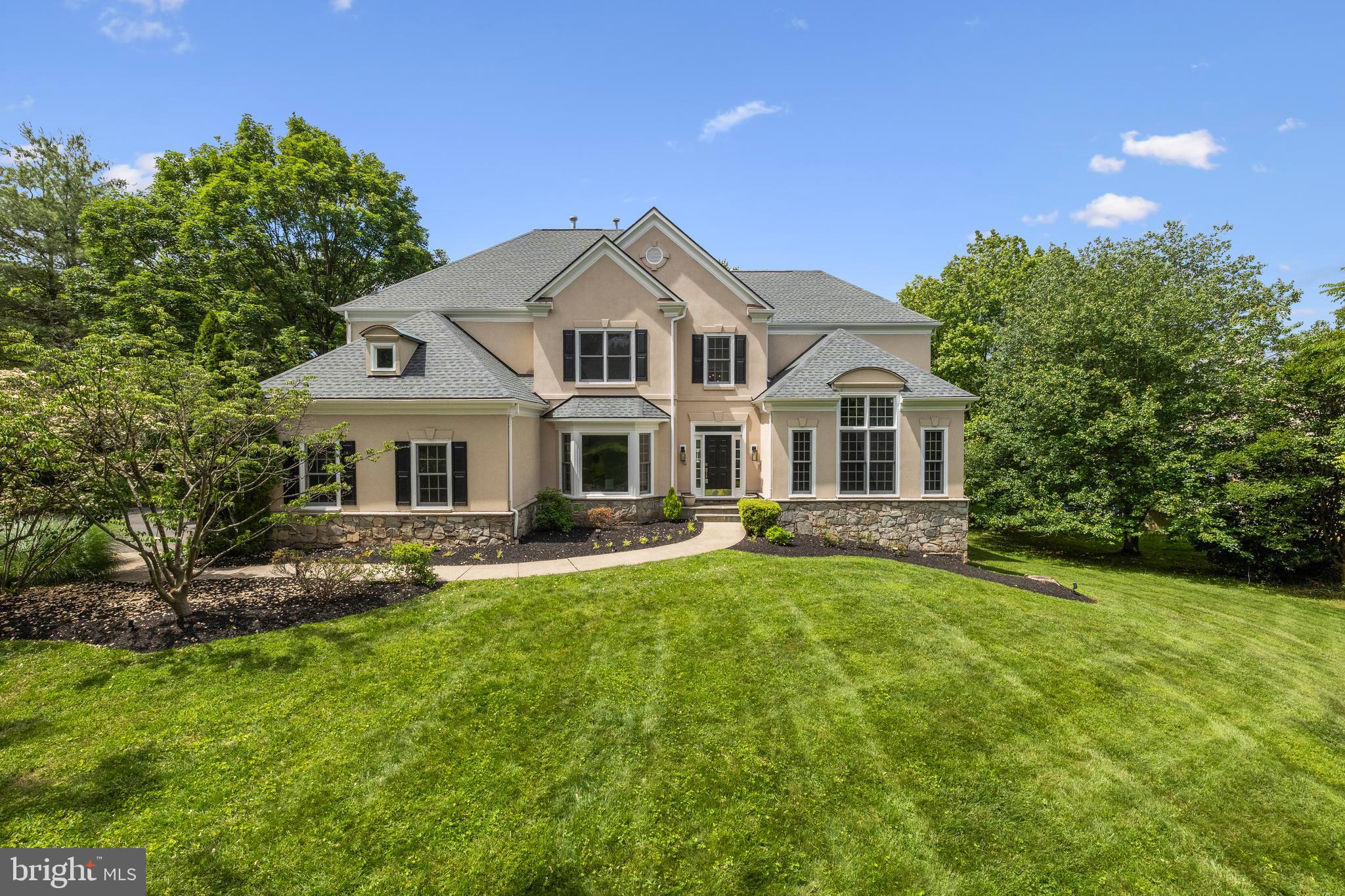 Graciously set on nearly an acre in the prestigious McLean Hundred community, 1418 Woodhurst Blvd is a beautiful 6-bedroom, 5.5-bathroom estate that offers a rare combination of classic elegance, thoughtful updates, and prime location. With 6000 sq ft of finished living space, this home is a showcase of refined living. Step through the grand two-story foyer, where light pours in and the architectural detail sets an elevated tone. The main level primary suite is a serene retreat, complete with an en-suite bathroom and walk-in closet. A stately home office/library with rich built-ins creates a distinguished work-from-home space. The heart of the home is a beautifully updated chef’s kitchen, open to the family area and warmed by a two-sided fireplace, creating an inviting setting for everyday living and elegant entertaining. Formal living and dining rooms offer additional space for hosting with style. Upstairs, four spacious bedrooms each enjoy en-suite baths, offering ultimate comfort and privacy for the family. The fully finished walkout lower level extends the living space with a generous recreation room, sixth bedroom, and full bath ideal for a guest suite, au pair quarters, or home gym. Outside, the expansive, freshly painted deck overlooks lush grounds perfect for al fresco dining or quiet evenings under the stars. A private driveway, 3-car side-load garage, and fresh interior paint throughout elevate the turnkey appeal. Set within a community known for its elegance and walkability, residents enjoy sidewalk-lined streets, a private 4-acre neighborhood park, and direct walking access to the Silver Line Metro. All just moments from Tysons Corner, Dulles Toll Road, I-495, and Washington, D.C. Located in the top-rated Spring Hill ES, Cooper MS, and Langley HS pyramid, this is an exceptional offering in one of Northern Virginia’s most sought-after enclaves. Experience the rare blend of sophistication, comfort, and location.