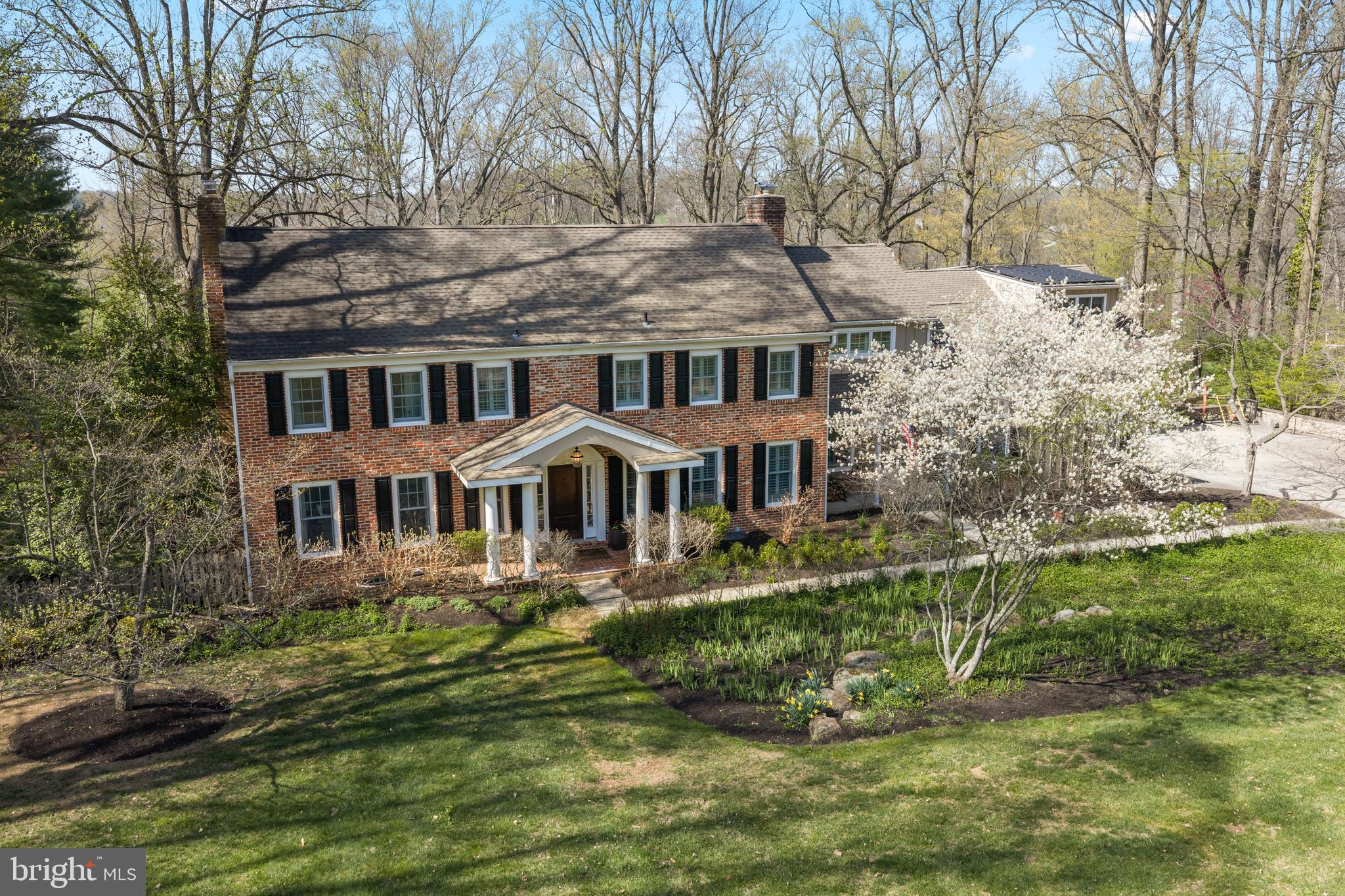 Welcome home! This stunning 5 bedroom, 4/1 bath brick colonial home nestled on 2 acres in Radnor Hunt is waiting for just for you! The first floor offers a gracious entry foyer with coat closet, formal sundrenched living room with marble fireplace and recessed lighting perfect for those special gatherings. Dining room with French doors leading to patio. The Cook’s kitchen includes a center island with plenty of storage, coffee bar nook, updated stainless steel appliances with outdoor entry. Architecturally stunning breakfast room with walls of windows and octagonal tray ceiling. Kitchen flows into the fireside family room and the vaulted ceiling game/tv room. Oversized mudroom with cubbies/drawers offering great storage space. Office, guest room, and powder room complete the first floor. The second floor boasts a lovely primary suite with a vaulted faceted ceiling, spa-like bathroom, stall shower, double sinks, soaking tub, plus two walk-in closet with built-ins. Completing the 2nd floor is a full laundry room with sink, 2 bedrooms with a jack and jill bath, a 4th bedroom with an ensuite bath and stairs to a floored attic. Finished walk-out basement with family room and a full bath. There is a separate unfinished area for storage and mechanicals. Two car garage, has a finished bonus room for an office, gym, music room, etc. Fabulous rear stone patio with stone fireplace, grill and two patio heat lamps. Steps leading down to the lower terrace and propane heated pool with gazebo. All this is surrounded by beautiful landscaping and breath-taking views make this a perfect space for entertaining and a place to call home.