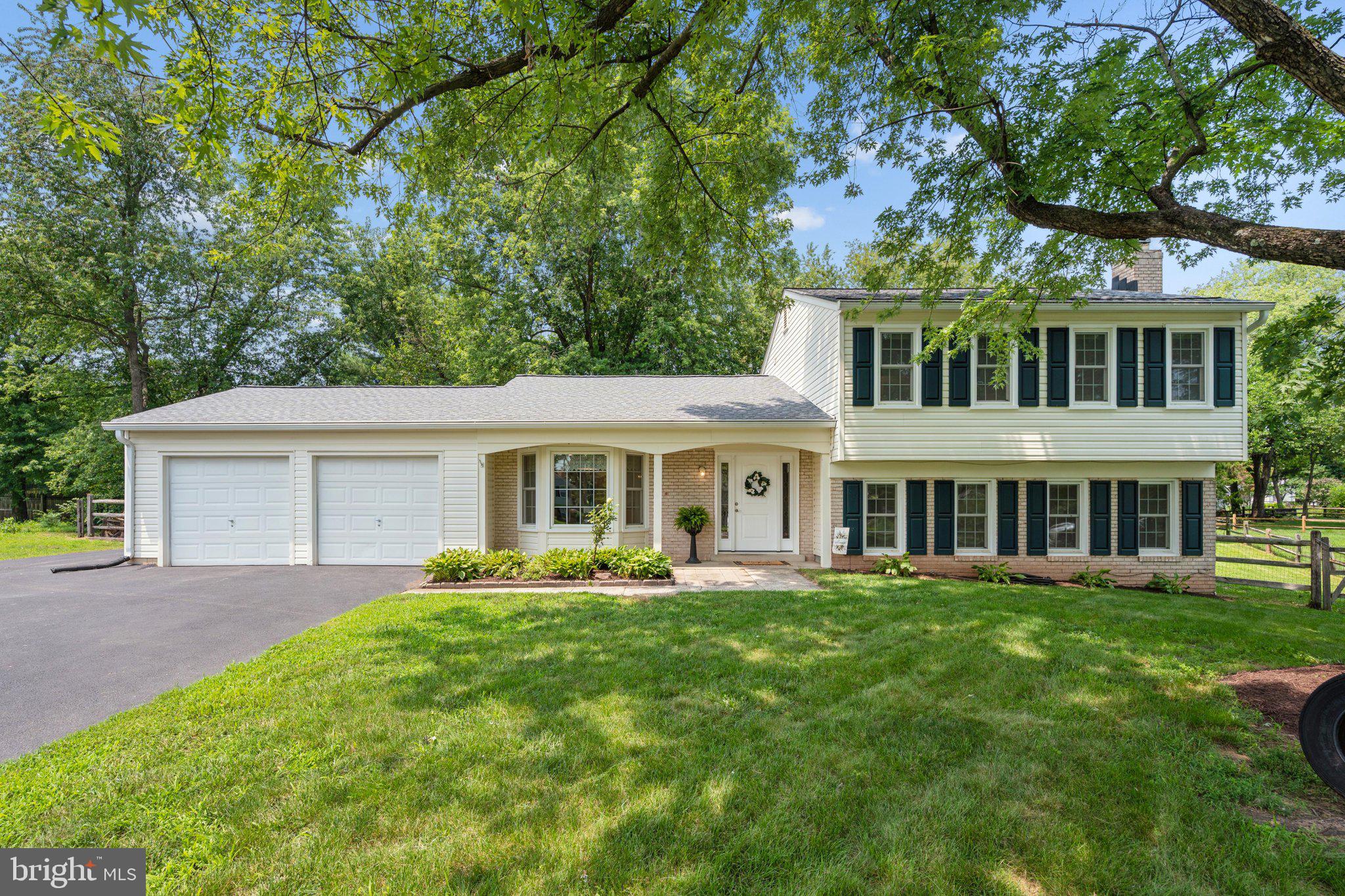 **Open Sunday, 7/19/26, 12-2 pm!** Welcome home! This charming 3 BR, 2.5 BA split-level Colonial, is situated on a quiet cul-de-sac with a large driveway and two car garage! Offering the ideal blend of comfort, space, and functionality, this home features a versatile split-level floor plan that offers an updated eat-in kitchen, formal dining room with comfortable living spaces. Enjoy the living room’s built-in cabinets, the sunroom leading to the wrap around deck, the family room complete with a cozy wood stove - this home offers something for everyone. Enjoy outdoor living on the wrap-around deck, featuring a screened-in section that's perfect for relaxing with your morning coffee, entertaining friends, or enjoying summer evenings without the bugs. The private backyard has a substantial shed along with an additional smaller shed, both of which convey. The outdoor space provides plenty of room for gardening, play, or simply unwinding. Recent updates include: Thompson Creek Windows (2017-2018), Whole House Water Filter & Salt-Free Water Softener (2018), New Roof, Gutters & Downspouts (2019), Refrigerator & Dishwasher (2025), LVP flooring, Carpet & Fresh interior Paint (2026). Walk to schools, shops, restaurants, parks, community events and public transportation! Don't miss your opportunity to make this wonderful property your next home! Estimated Mo. Co. Taxes: $6,455.34