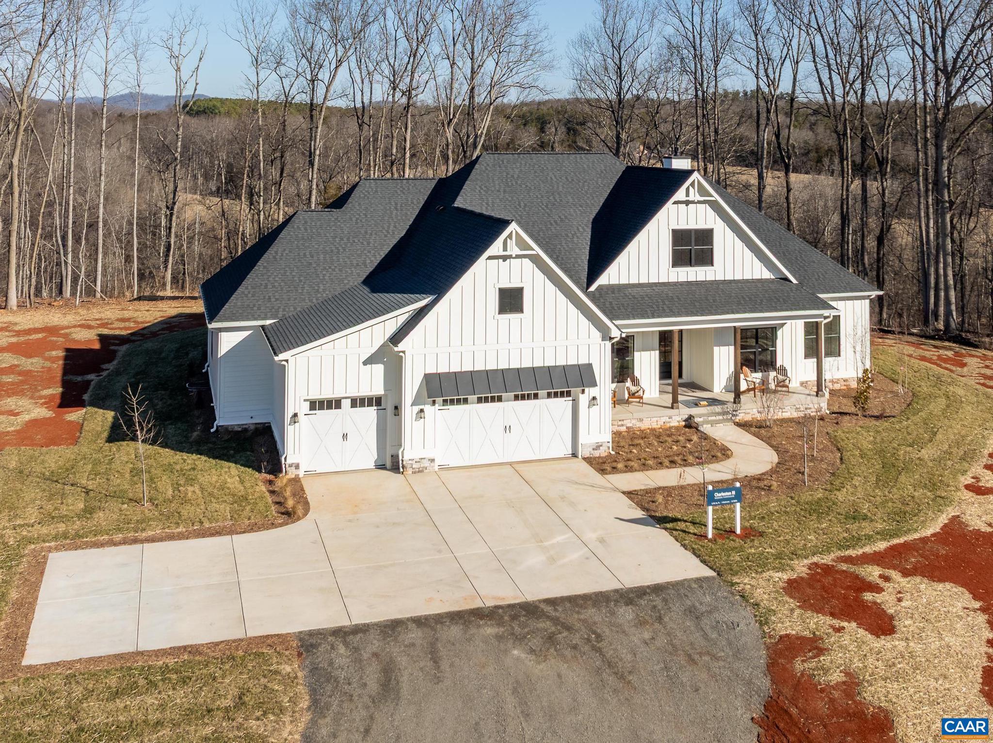 Brand new Schumacher Homes Charleston III model offered on over 10 picturesque  acres with breathtaking MOUNTAIN VIEWS. Architecturally stunning main-level living home from soaring 12? ceilings to curated designer fixtures, no detail has been overlooked. A welcoming foyer opens to expansive open-concept living and dining area, anchored by a dramatic Great Room with gas fireplace and a wall of windows. Impressive chef?s kitchen with gas cooking, stainless appliances, stone countertops, and a show-stopping ?messy kitchen? featuring a second refrigerator, sink, dishwasher, and a full wall of pantry shelving?perfect for entertaining and effortless organization. The main-level owner?s suite is a true retreat with a spa-like bath, oversized glass-enclosed shower, dual vanities, and a jaw-dropping two-story walk-in closet with custom organizers, center islands, and glass cabinetry. Three additional bedrooms and two baths including a private ensuite. A massive unfinished basement could be finished by the builder if desired - big enough to accommodate an additional bedroom, full bath, home theater, rec room and game space plus storage. Enjoy outdoor living on the covered rear porch or patio, surrounded by peaceful mountain scenery.,White Cabinets,Wood Cabinets,Fireplace in Family Room,Fireplace in Great Room