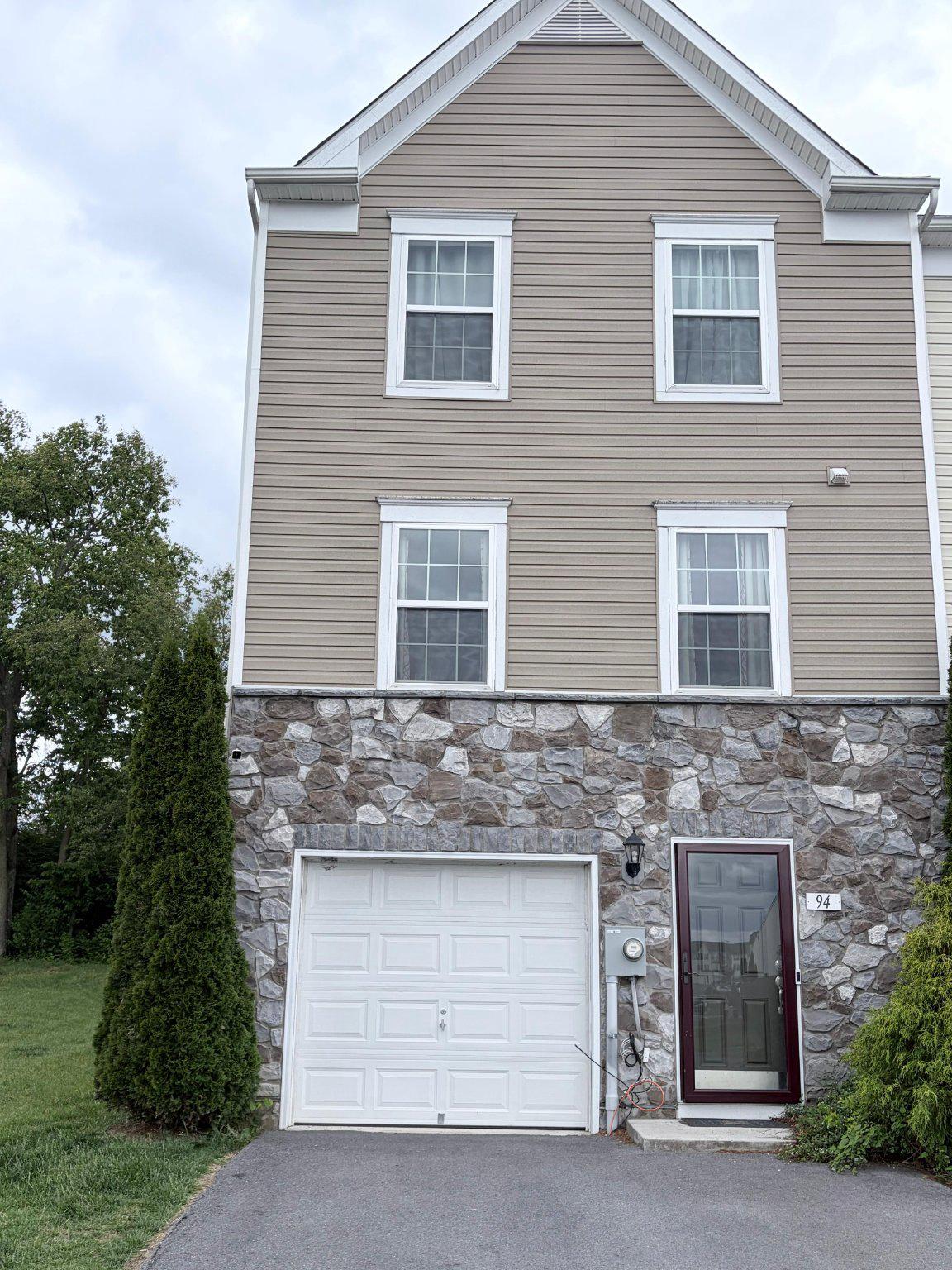 Welcome to Convenient Living in this end unit townhouse nestled right on the edge of all the hustle and bustle of downtown. Located close to major roadways, shopping, schools, and more. Enter this townhome on the basement level which features a walk-out finished space, rough-in for a full bath, laundry closet, and space to grow. Meander up the stairs to the main living area that features a large eat-in kitchen with an island and room for a kitchen table. The bonus sunroom area offers lots of light for extra dining, office space, or a small sitting area with a sliding glass door to walk out onto a future deck. The family room provides plenty of space for a cozy night in. At the end of the day retreat up to the 3rd level to a large primary bedroom featuring a large bath with dual vanity, soaking tub, and walk-in shower, a walk-in closet, and a suite big enough for a large bed and a sitting area. 2 smaller bedrooms round out this level with a full bath and plenty of closet spaces. Plus this end unit townhouse is right next to a common area for the subdivision and backs to trees. What a great place to call home.
