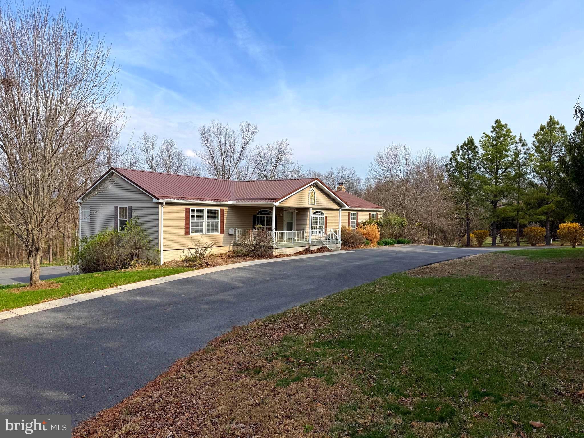 BACK ON THE MARKET DUE TO NO FAULT OF SELLER OR PROPERTY.  Spacious and versatile, this beautifully maintained home offers over 3,500 finished square feet on 2.2 acres in an established neighborhood on a no thru street. Featuring 3 bedrooms and 3.5 baths, this property is designed for comfort, functionality, and multi-generational living.
The main level welcomes you with a bright, open living area featuring cathedral ceilings that create an airy, expansive feel.  Enjoy a separate dining room, and a cozy family room with a gas fireplace--perfect for relaxing evenings. The primary suite includes a private bath and walk-in closet, while a dedicated office provides the perfect work-from-home setup. A thoughtfully designed In-law suite adds flexibility for guests or extended family.
The lower level walkout basement expands your living space with a massive family/recreation room, a full third bath, abundant storage, and a flue for a wood stove—ideal for creating an additional cozy gathering area.
Outdoor living is just as impressive, featuring a covered front porch, an upper composite deck, and a lower-level concrete patio overlooking the peaceful setting. A stream borders the back of the property, enhancing the natural beauty.
Car enthusiasts and hobbyists will love the 2-car attached garage with plumbing, as well as the impressive 32'x48' detached garage/workshop complete with a half bath, wood stove flue, and stairway access to an upper storage area.
Additional highlights include paved parking, a circular driveway, sidewalks, and mature, beautifully flowering landscaping.
This property offers space, flexibility, seclusion and serene surrounding.  Be sure to click on the camera icon for your personal 3D tour and call today for an appointment to see it up close!