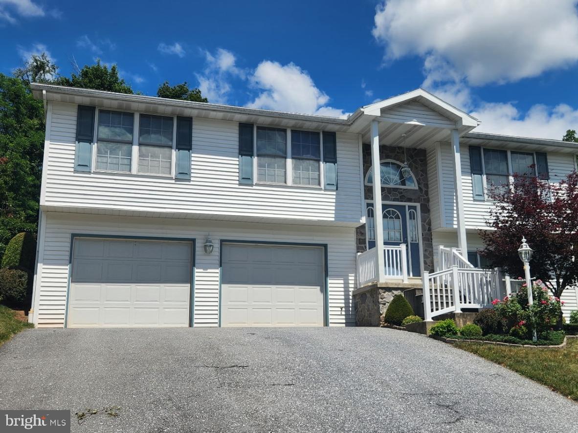 Welcome home to this exceptionally well maintained bi level in Duncannon Borough.  This home boasts real hardwood floors through upper level living room and dining room, Hardwood cabinetry in kitchen, modern bathroom fixtures and neutral decor throughout.  Main level features 3 spacious bedrooms and 2 full bathrooms.  Owners suite features walk in closet and large bathroom.  Lower level has a finished rec room and large utility room with laundry and half bathroom.  Two car garage is a plus.  Deck on the rear of home overlooks the ample rear yard while the front of the home offers beautiful views of the mountains.  All this plus an integrated sprinkler system for added peace of mind.  Buyers will appreciate the move-in ready condition of this home.  Welcome home!